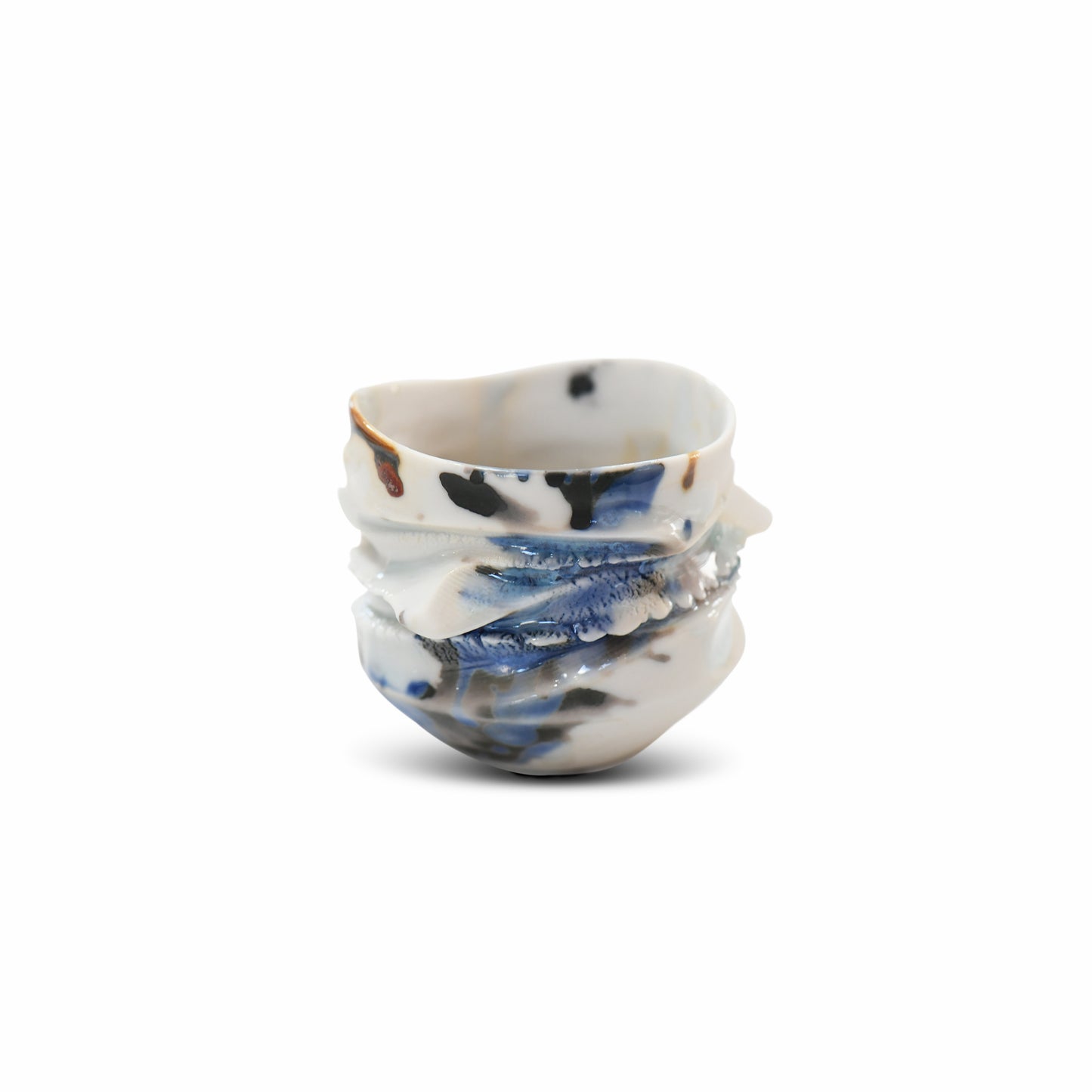 Artisan guinomi sake cup in porcelain with indigo and brown glaze layers and natural sculptural ridges.