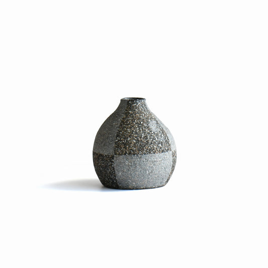 Back view of Gen’en bud vase showing subtle surface planes and speckled stoneware texture