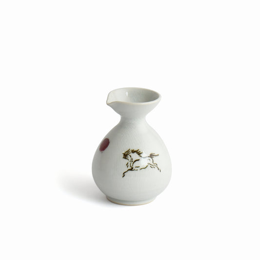 Front view of white sake carafe with Hidari-uma motif, Shunme set.