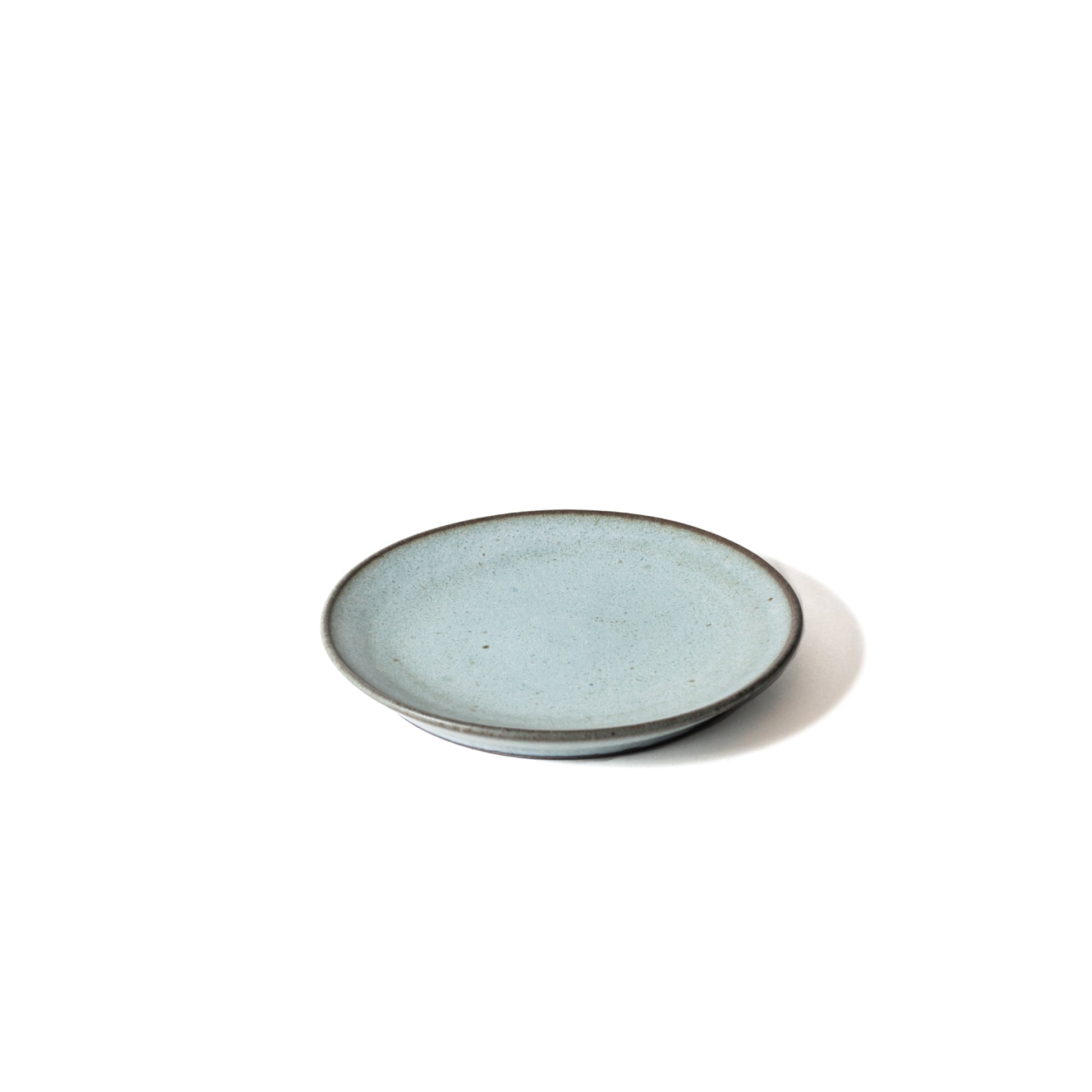 View from above. Smooth surface and beautiful darker blue edge. Sometimes dark area are shown because the glaze changes in the kiln.