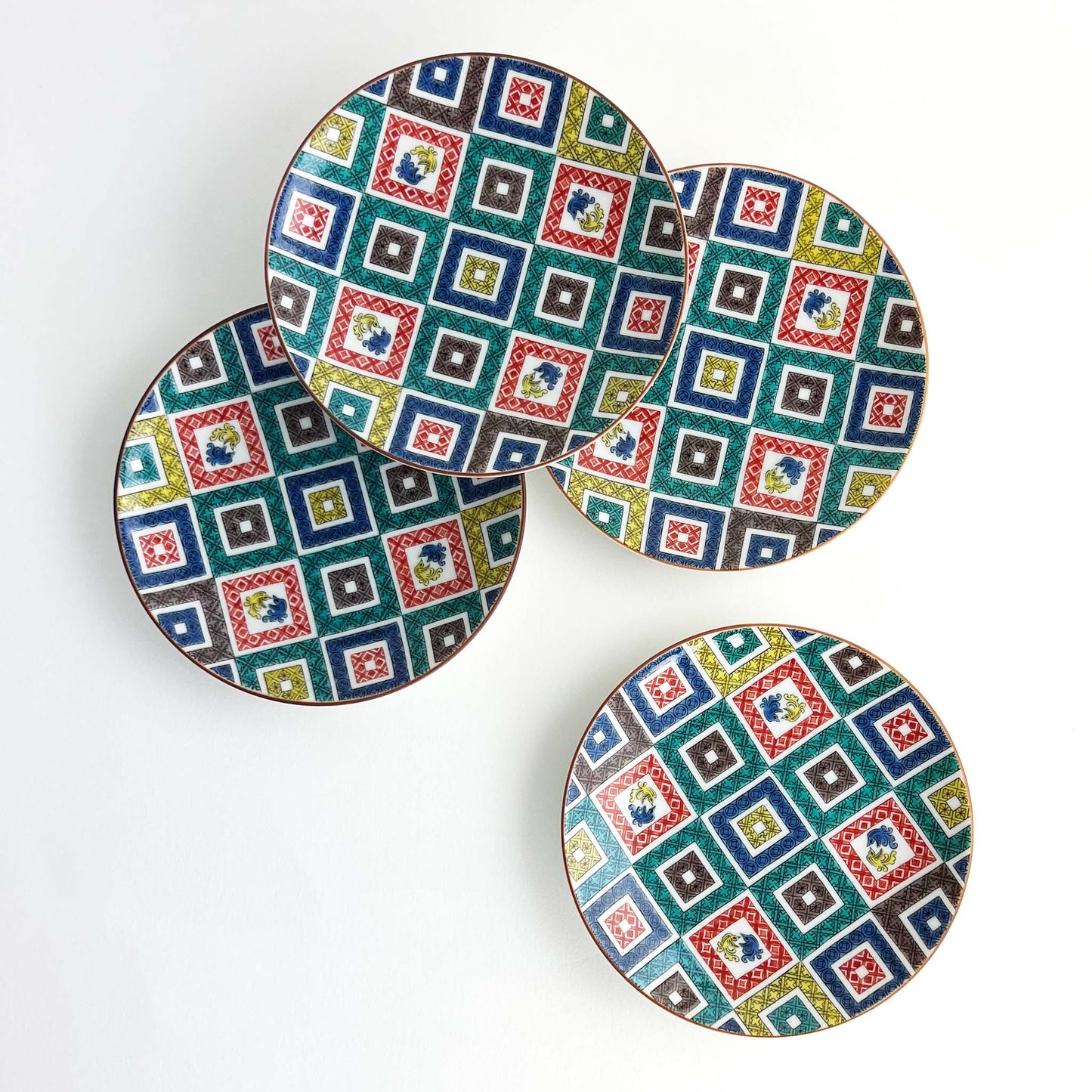 Red, blue, yellow, green, gray, square patterns on round dish