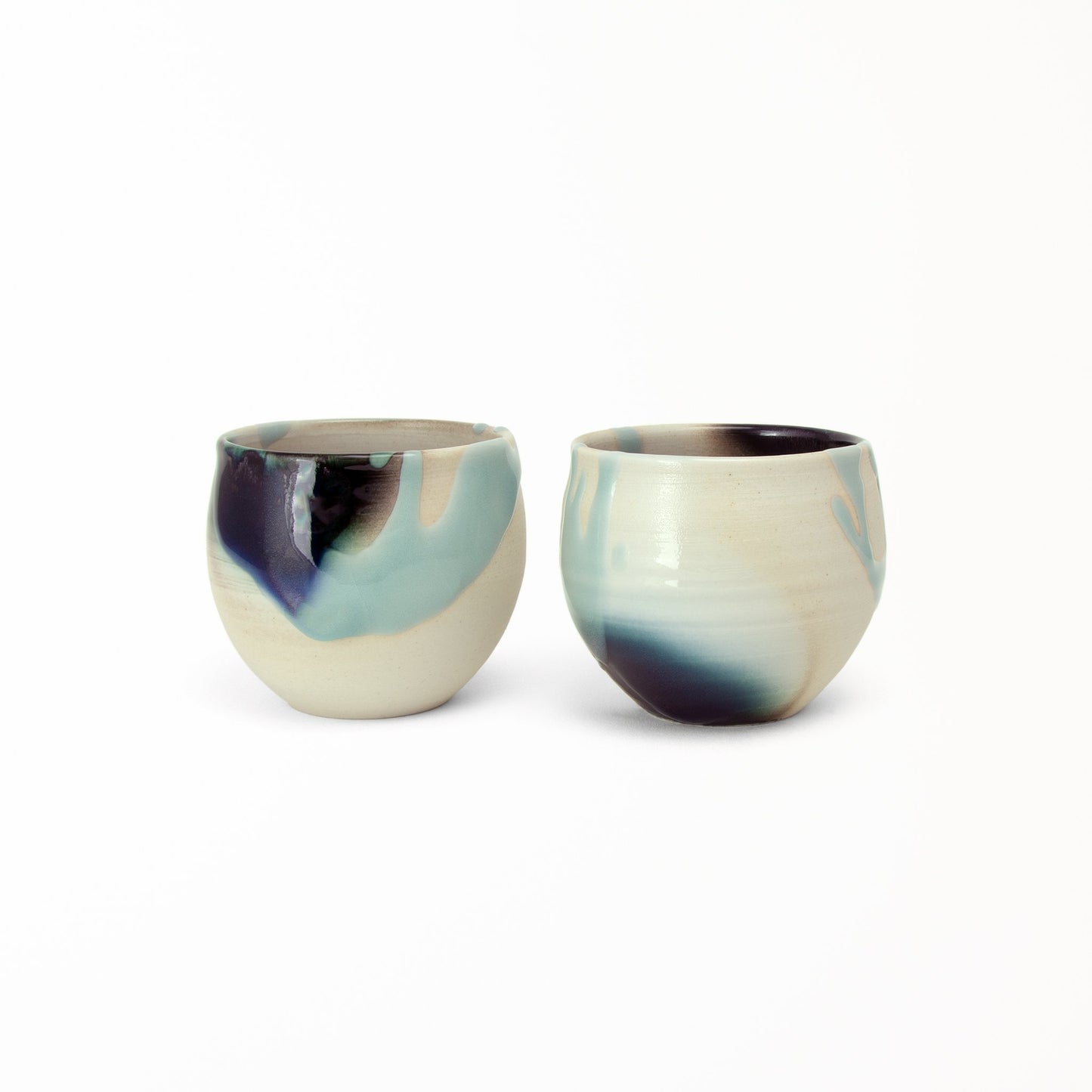 Two cup tea set Kage Ao raised glazed areas in blue over dark brown glaze natural off-white clay color