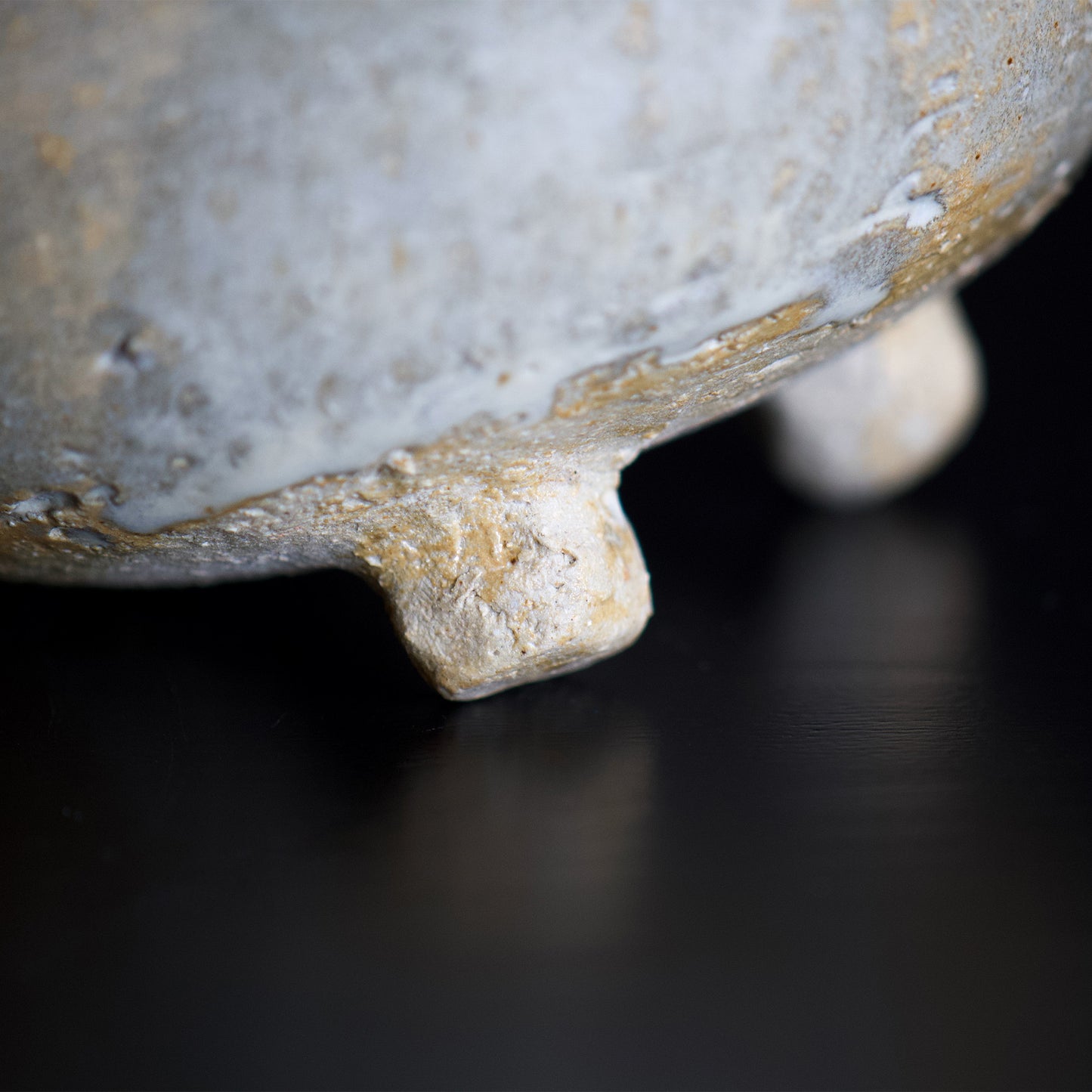 Close up view of the botom of the bowl. The foot has not glazed and it feels rustic feel.