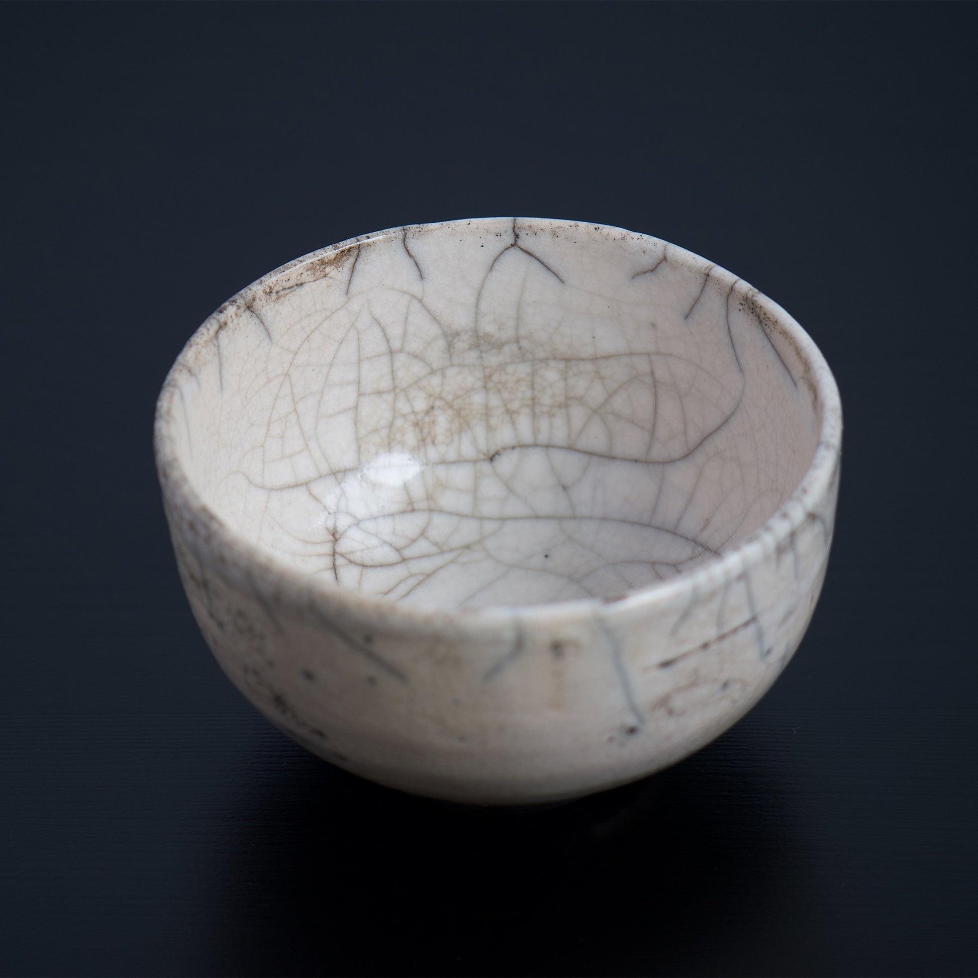 Other side view of the inside of the bowl. Beautiful kannyu lines. Please note that due to the nature of the "kannyu" technique, over time, the colors of food and drink may seep into the porous glaze material. However, you can reduce this effect by soaking or dampening the bowl with water before use. In Japan, it is common to enjoy the gradual changes in color and patina that come with use and aging of ceramics. Please keep this in mind when making your purchase.
