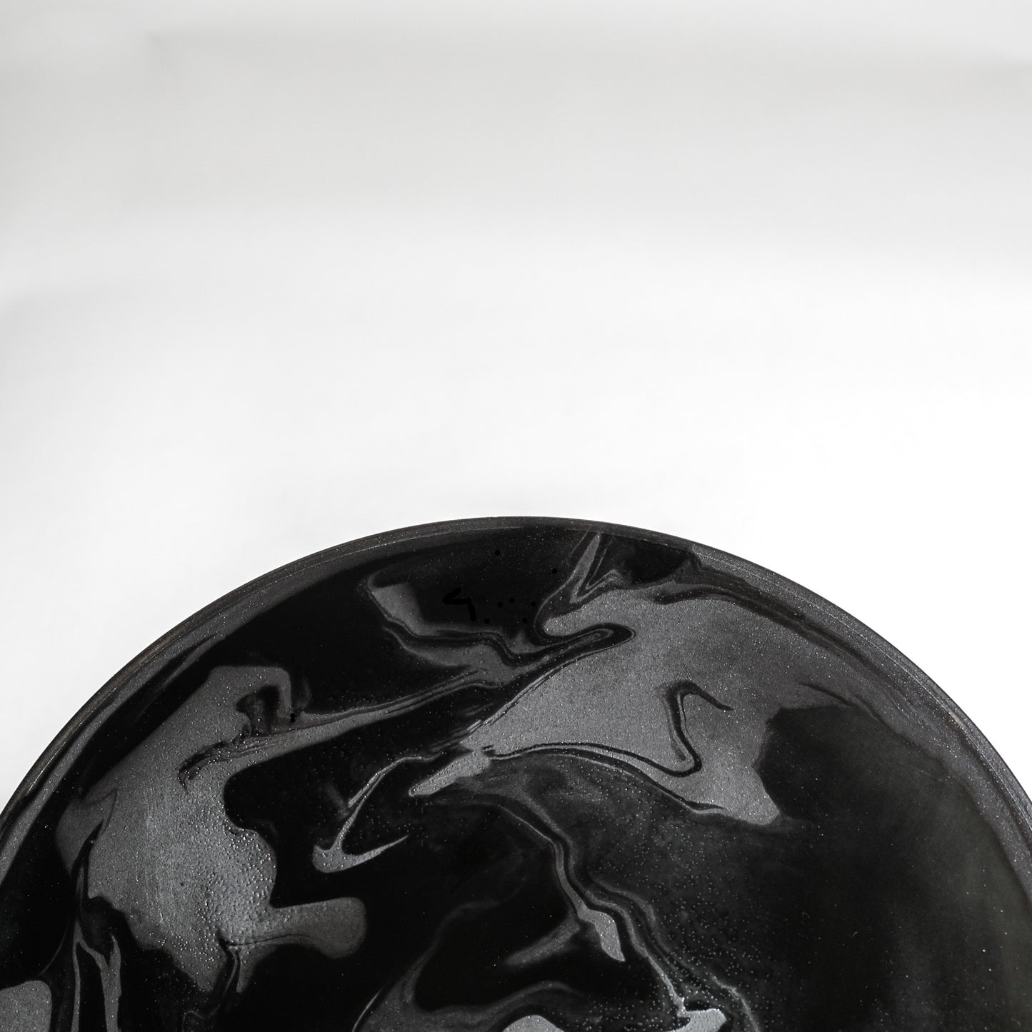 Close-up view of the plate. An elegant swirl pattern will give a sophisticated feel to your table.