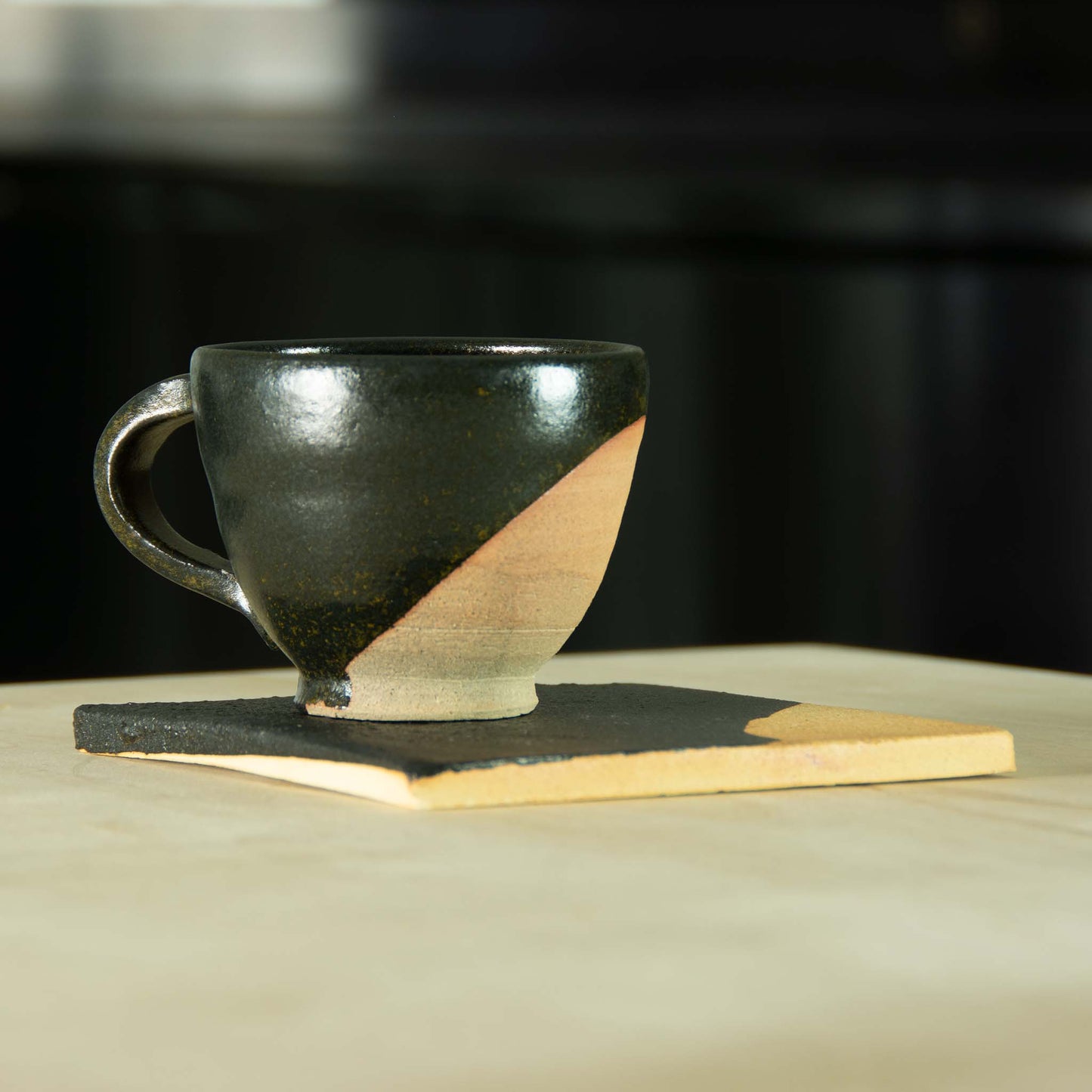 Dessert set partially glazed black with clay exposed with matching partially glazed small clay plate