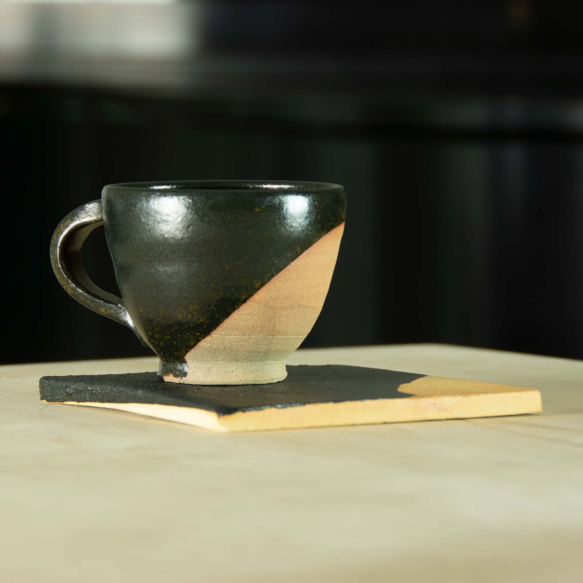 Dessert set partially glazed black with clay exposed with matching partially glazed small clay plate