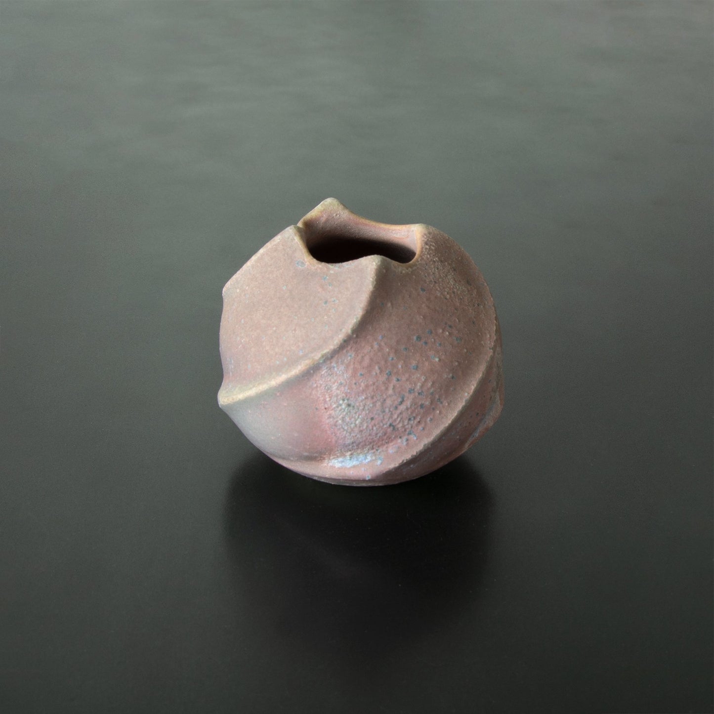 Handcrafted vase made in Japan Anagama Kinyo 5 raised spirals terminating at the top tulip shaped opening. one-of-a-kind flower vase.