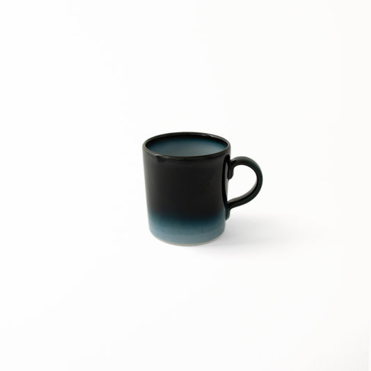 Modern Japanese ceramic Seto Blue mug deep blue glaze diffusing to lighter shades of blue at base