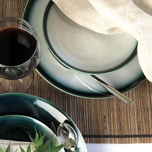 All occasion dishware place setting Shima White 4 piece deep blue border diffusing to light green rim