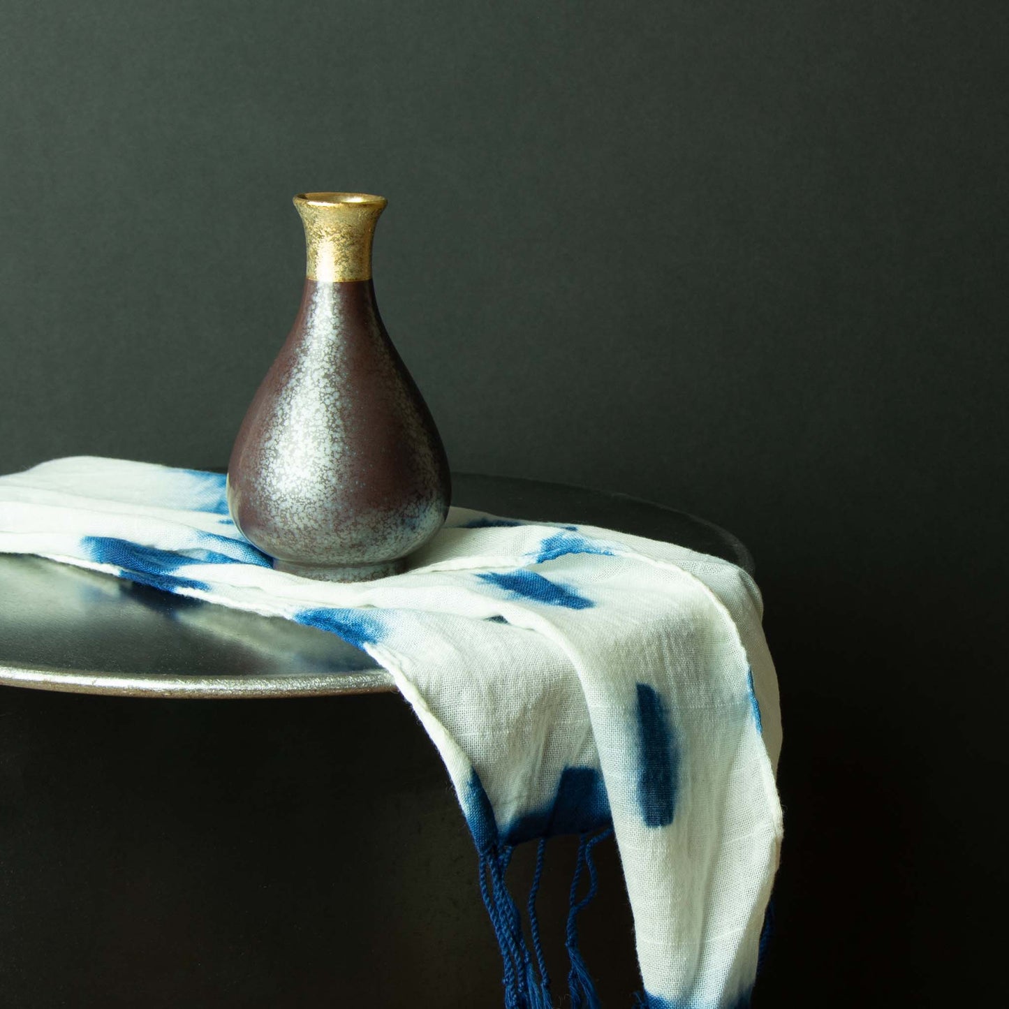 sake container vase with ring of gold at opening
