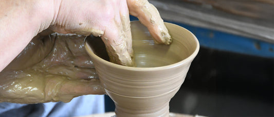 Mr. Honda shaping a rice bowl on the wheel at his Mashiko studio, hands steady as the clay forms into Japanese pottery.