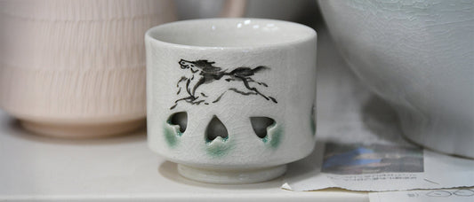 Ōbori Soma ware cup with the traditional running horse motif and blue crackle glaze