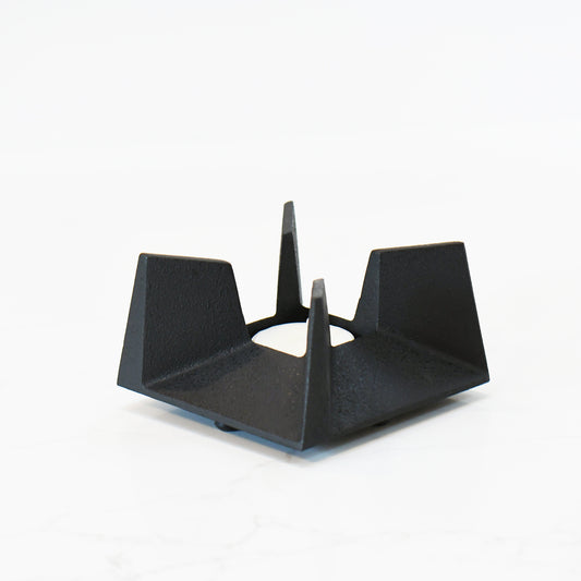 Side view of Japanese cast iron tea incense burner, highlighting its architectural form and open structure.