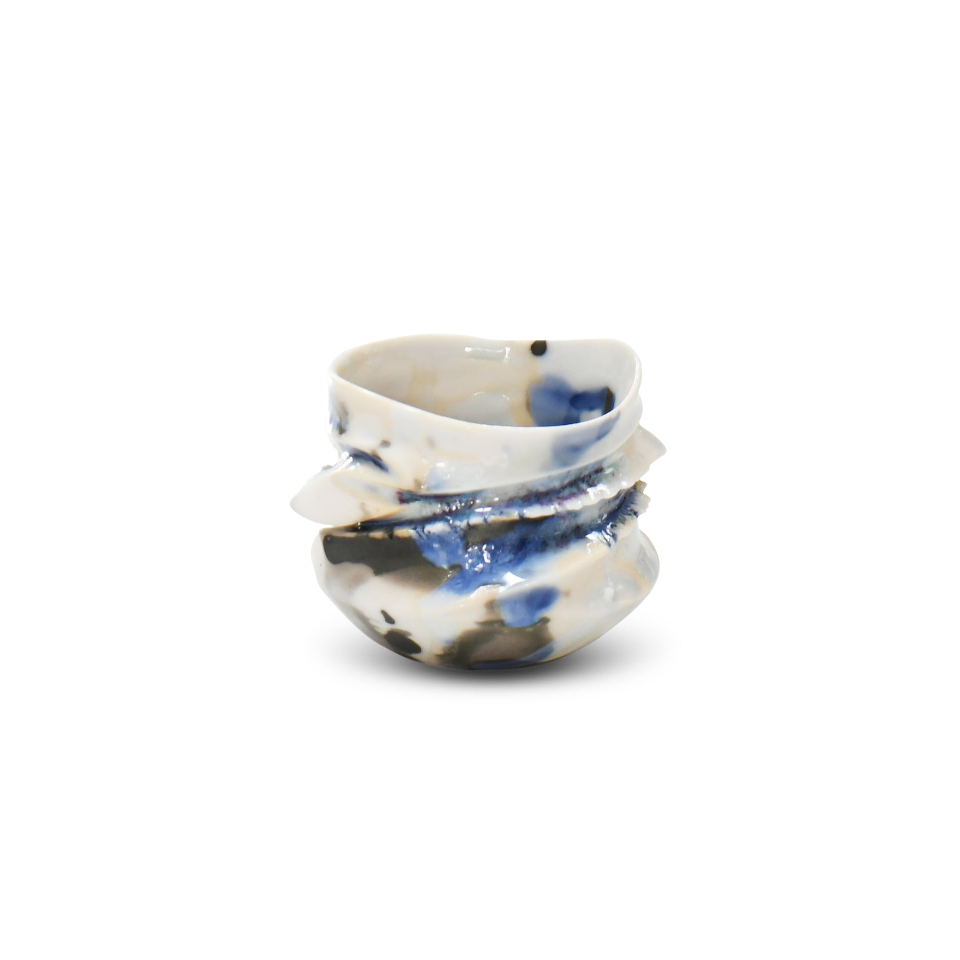 Handcrafted porcelain guinomi with flowing blue and gray glazes over white clay and softly folded contours.