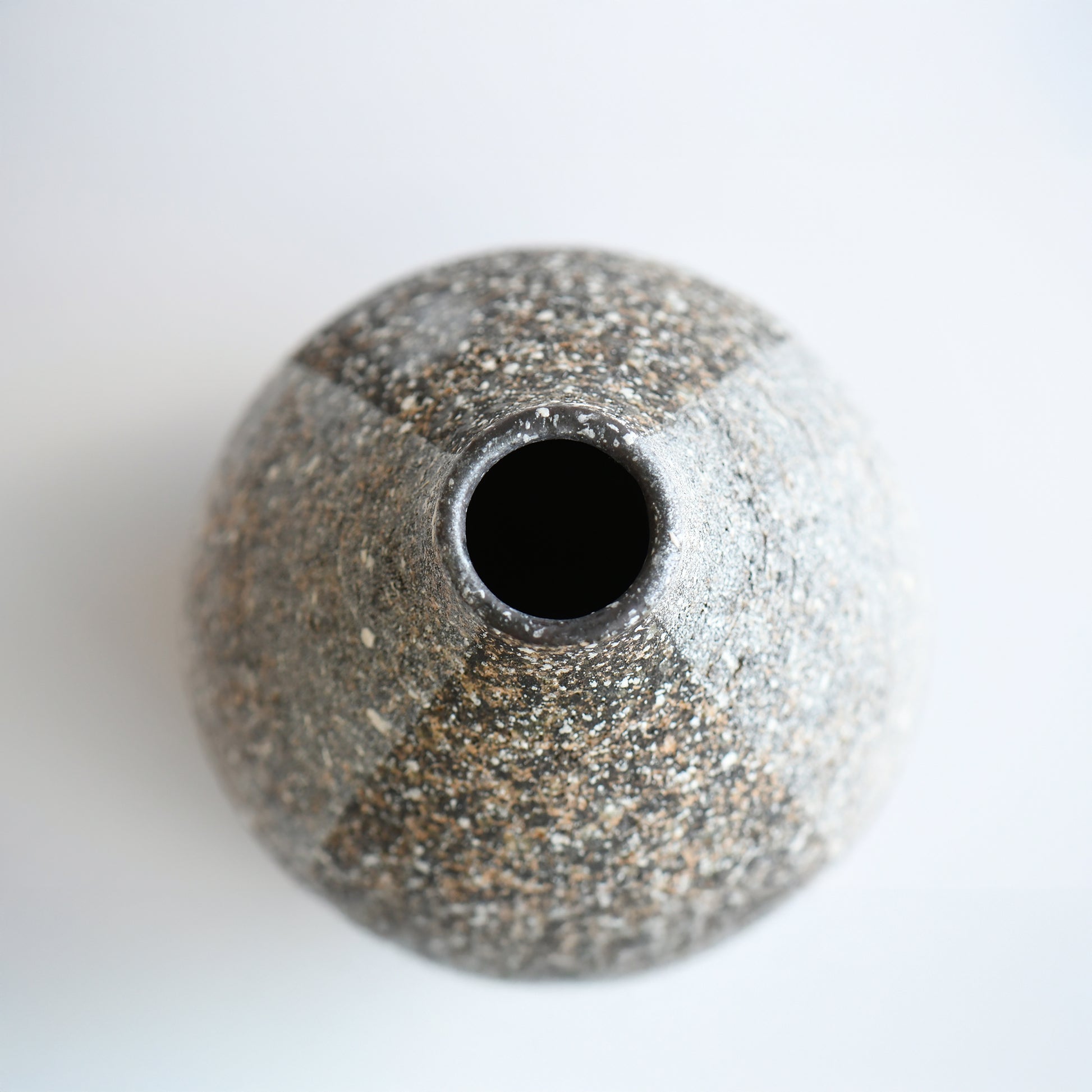 Top view of Gen’en bud vase with narrow opening and organic, rounded silhouette