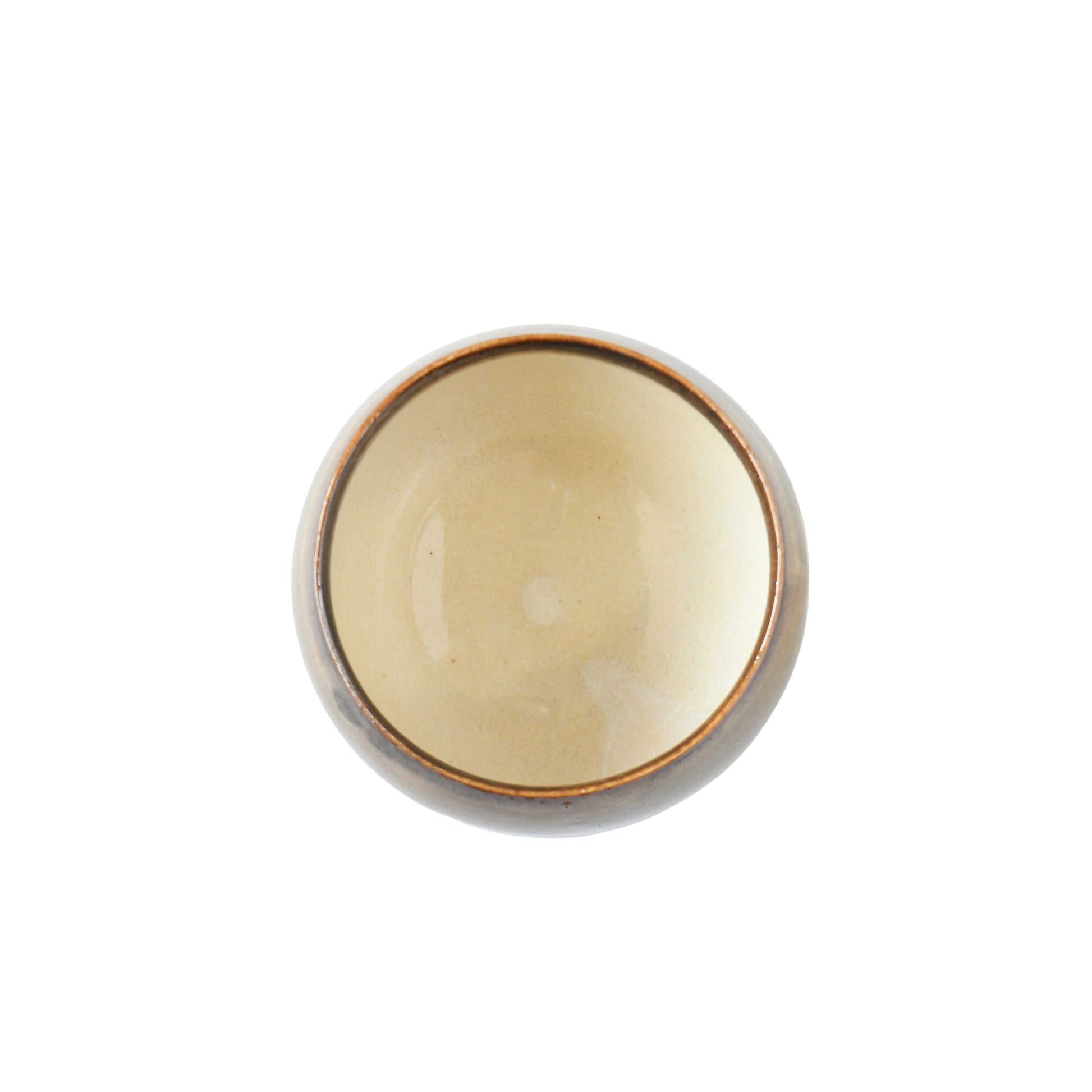 Top view of Yuhaku matcha bowl showing warm ivory interior and brown rim