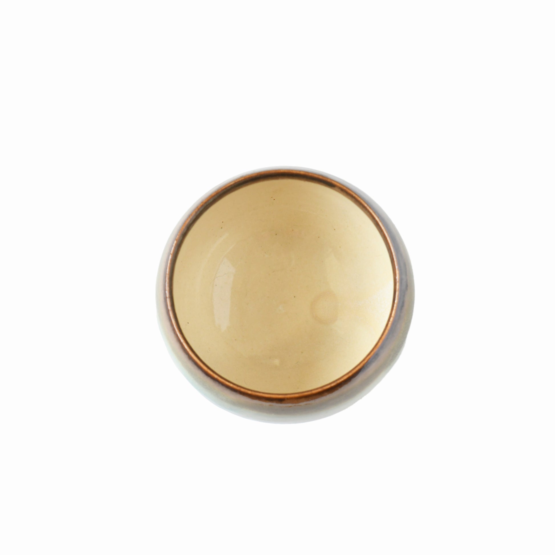 Top view of Yusumi matcha bowl showing warm ivory interior and brown rim
