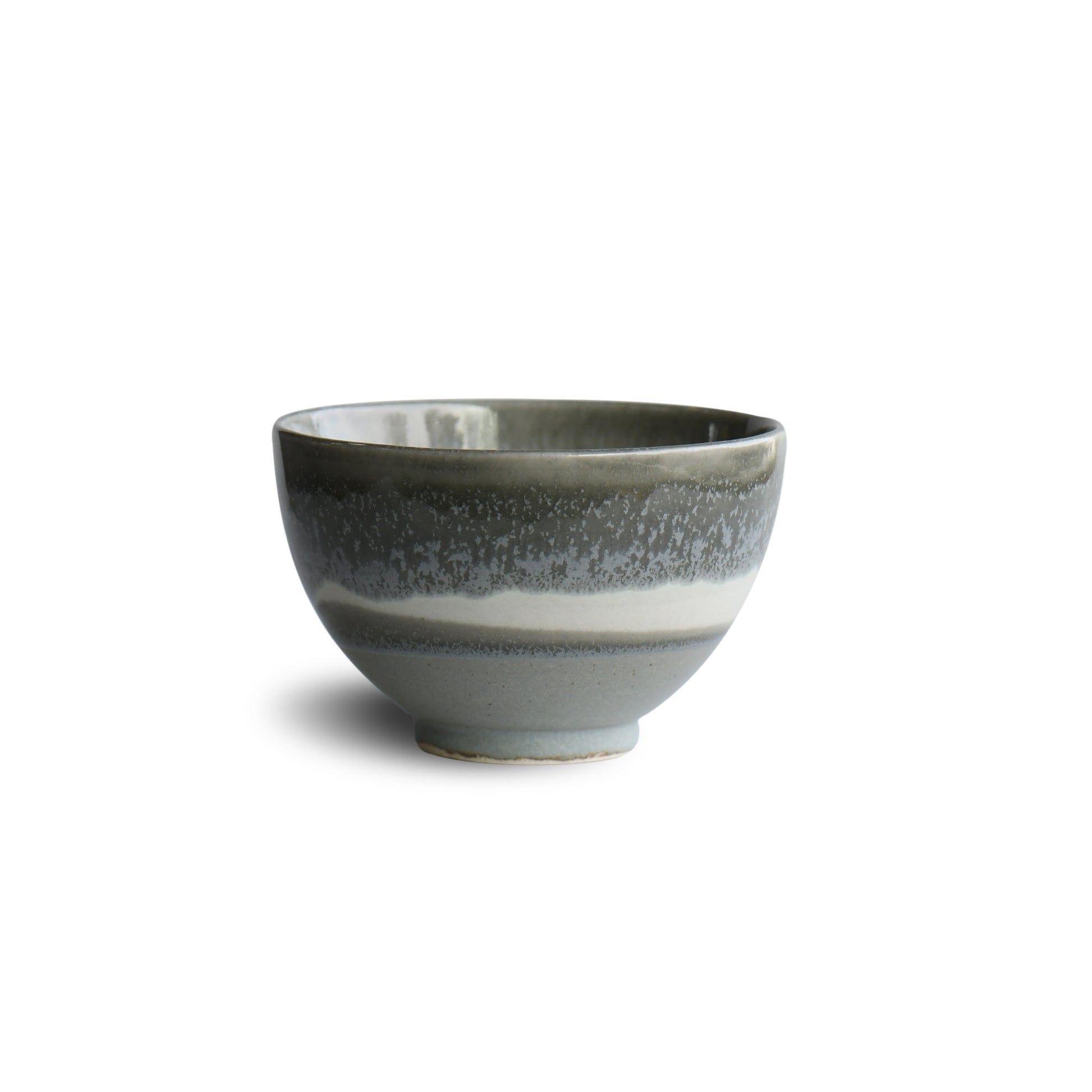 Side profile of Yusui Stormy Moss matcha bowl showing organic hand-thrown form and muted moss-grey finish