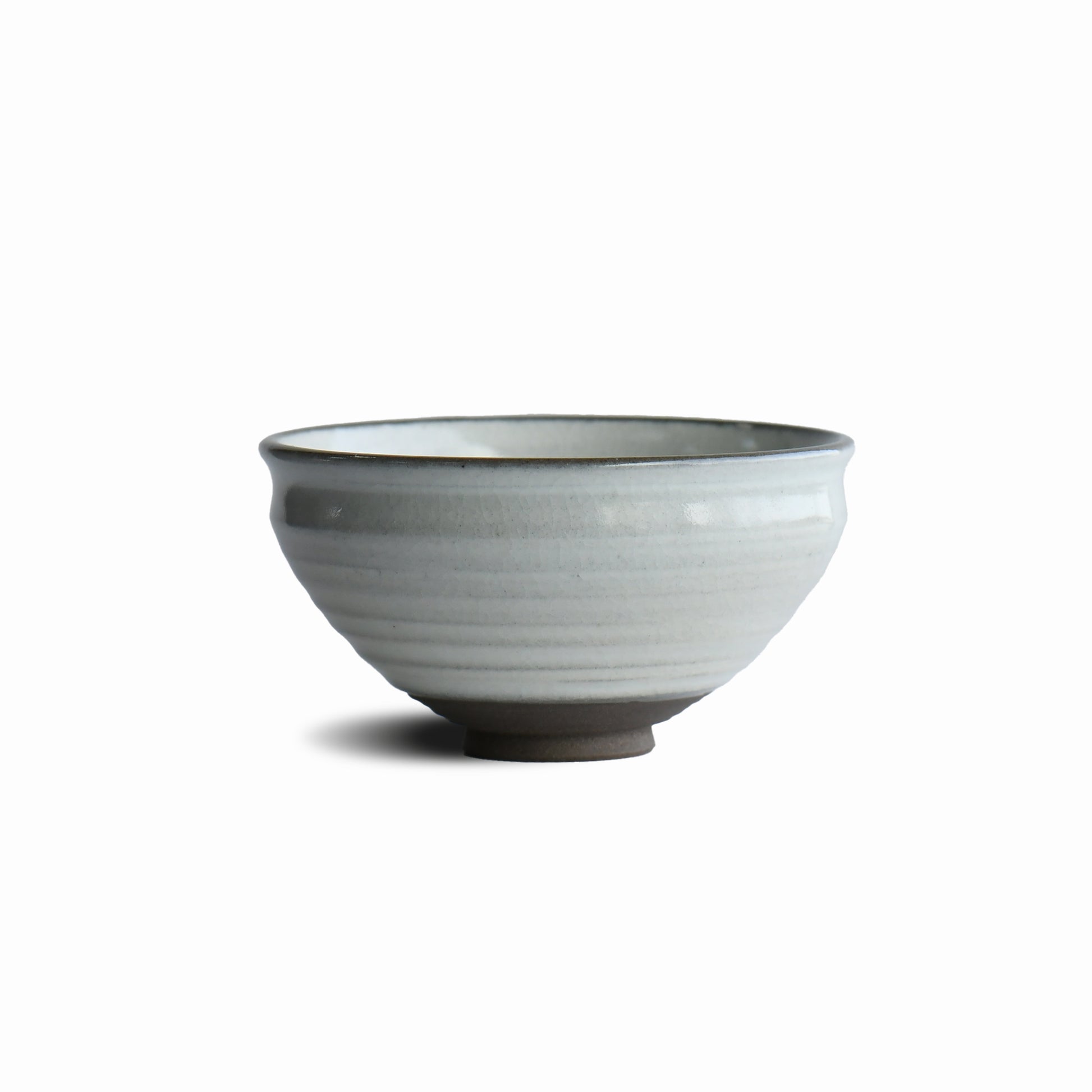 Hakuei white matcha bowl by Shinko Kiln with soft ivory glaze and gently rounded silhouette
