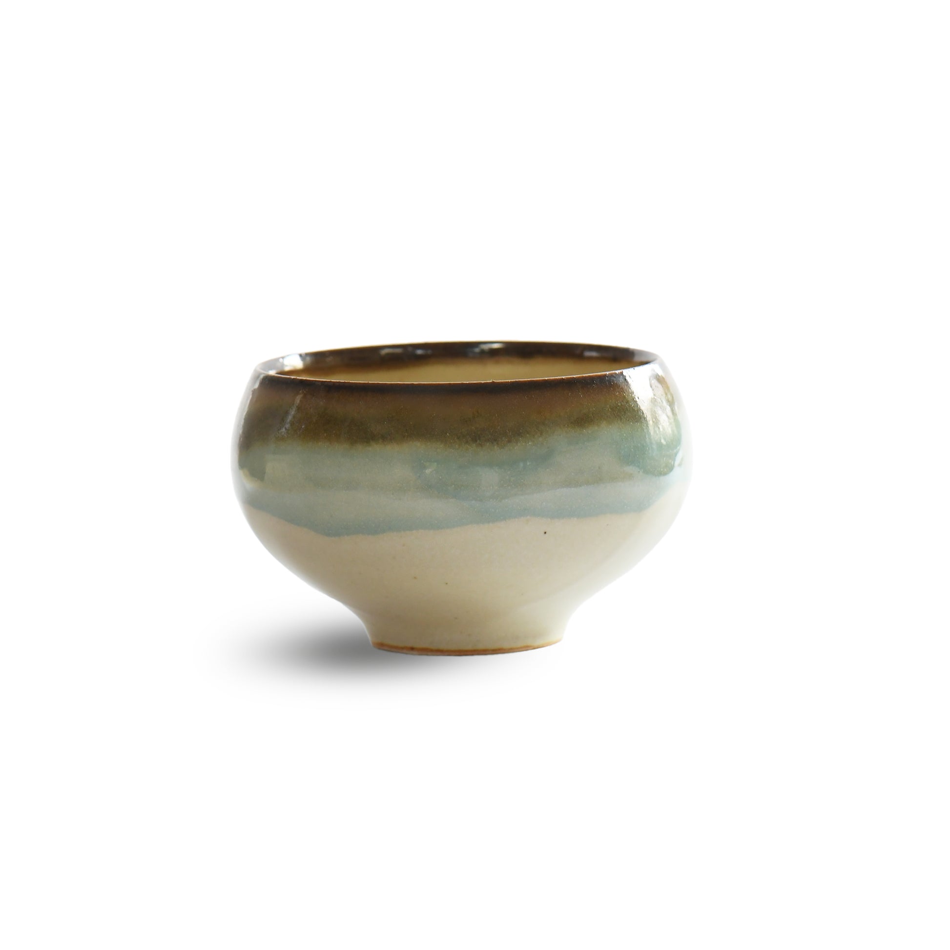 Angled side view highlighting layered glaze transition over ivory base