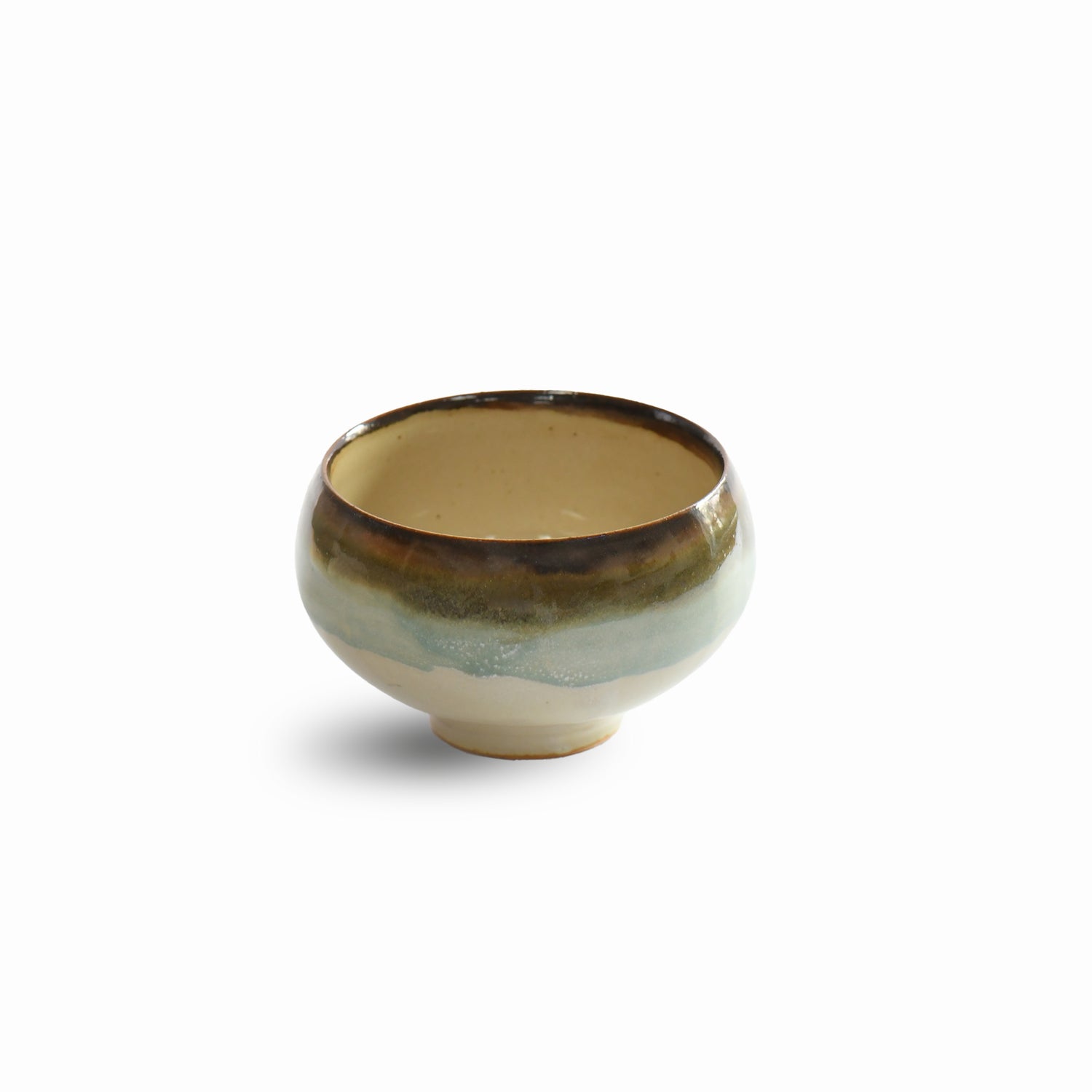 Yusumi (夕澄) matcha bowl by Kozan Kiln with misty blue-green glaze and brown rim, front view