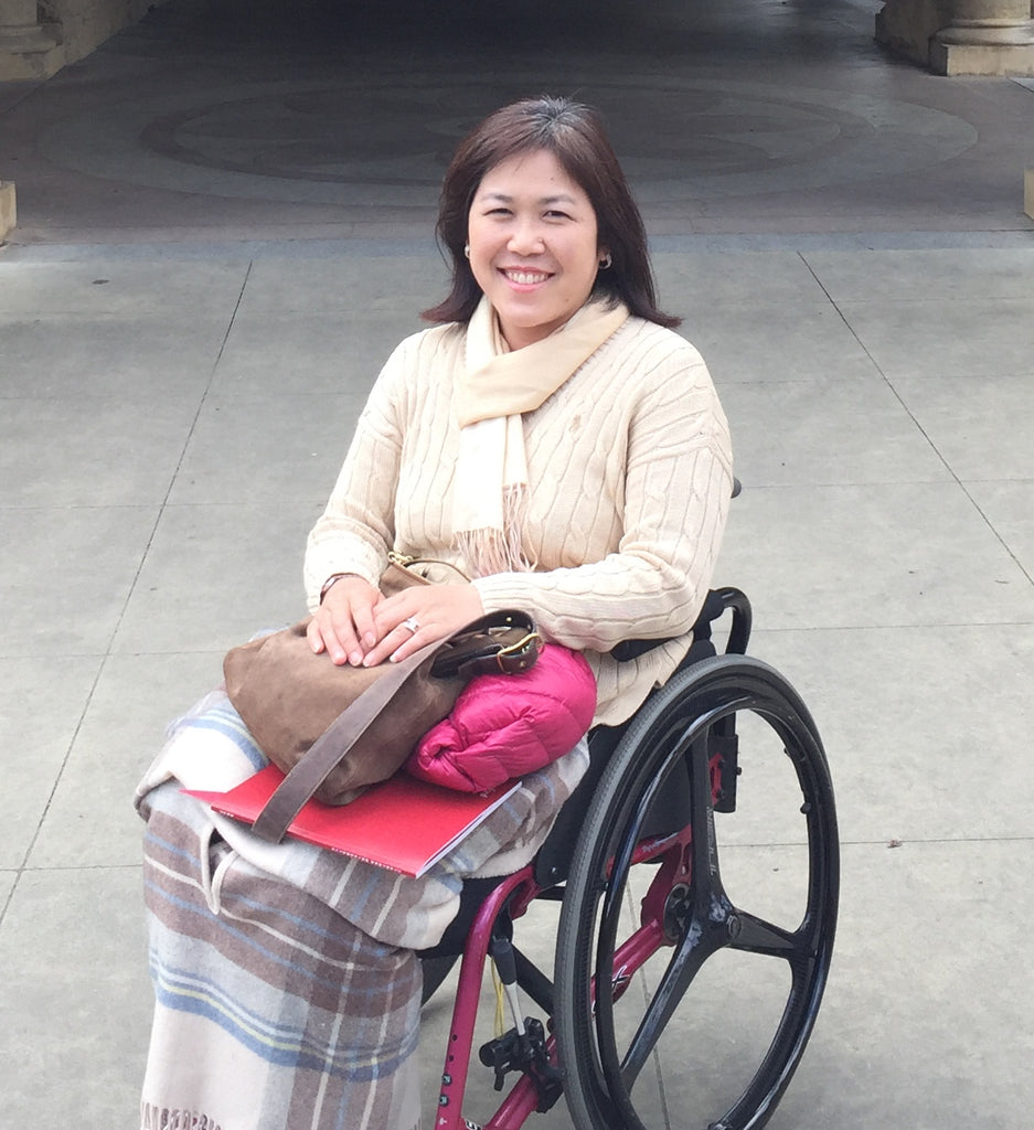 Photos of the owner of WAZA Tokyo, Kyoko Inahara is sitting on her wheelchair.