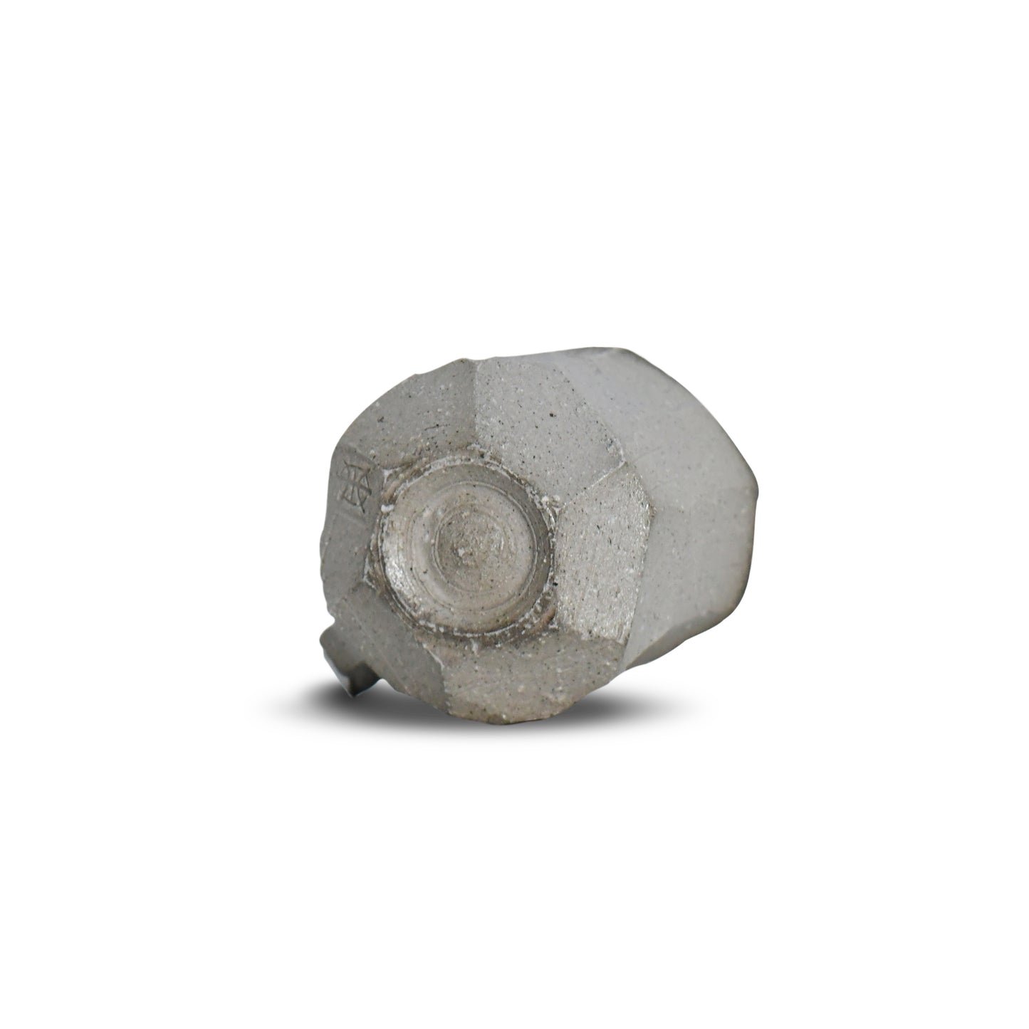 Bottom view of Suehiro’s faceted mug featuring raw clay base and maker’s mark.