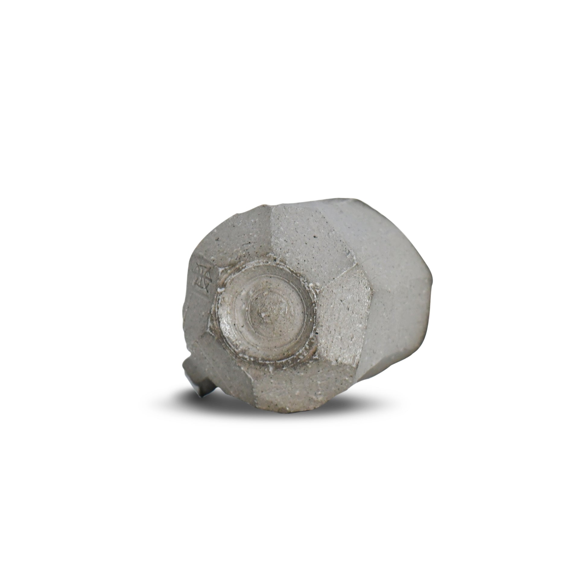 Bottom view of Suehiro’s faceted mug featuring raw clay base and maker’s mark.
