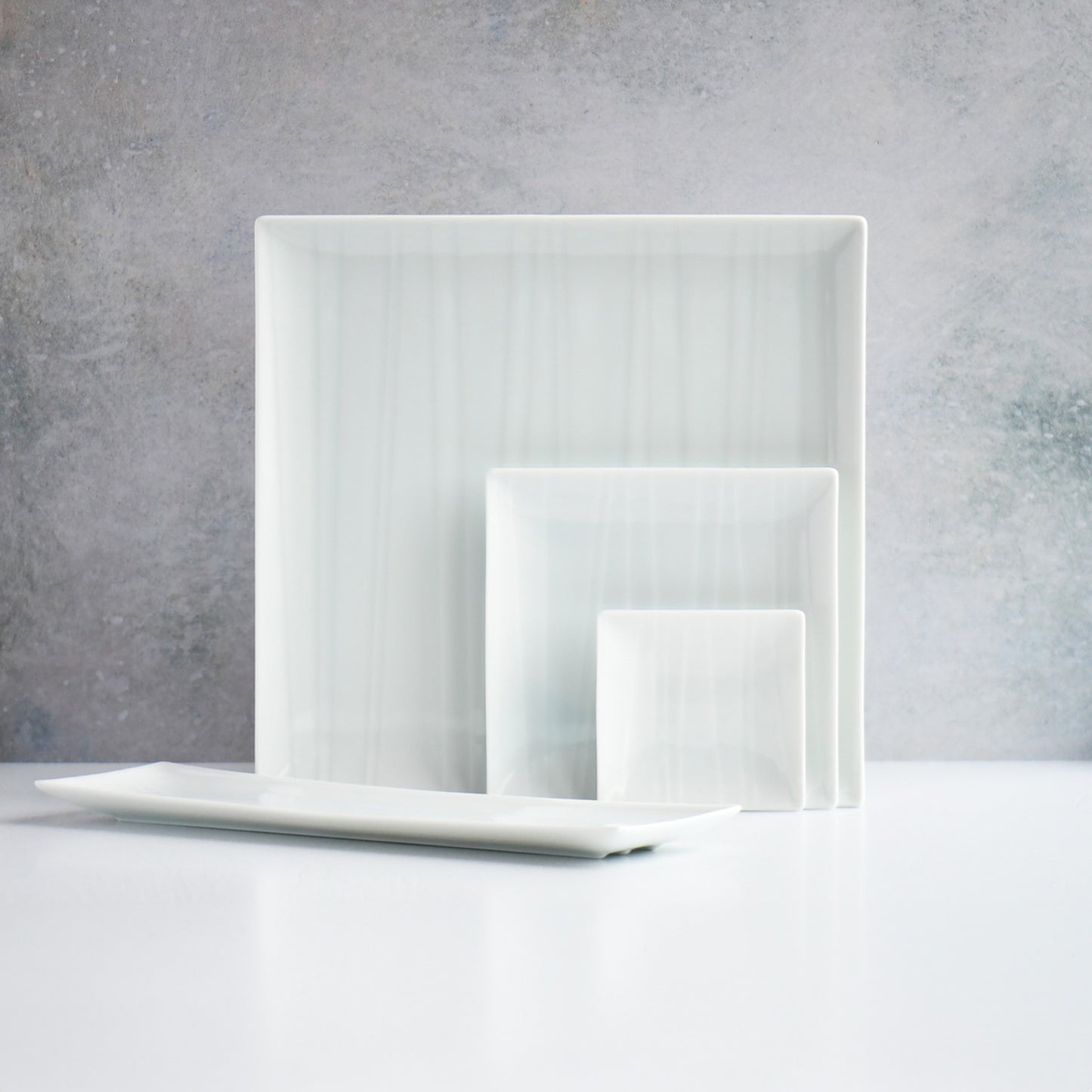 Square plate sets of dinner, salad and mini plate. Light blue base with white lines like a river flow. Japanese ceramics. Made in Japan.  