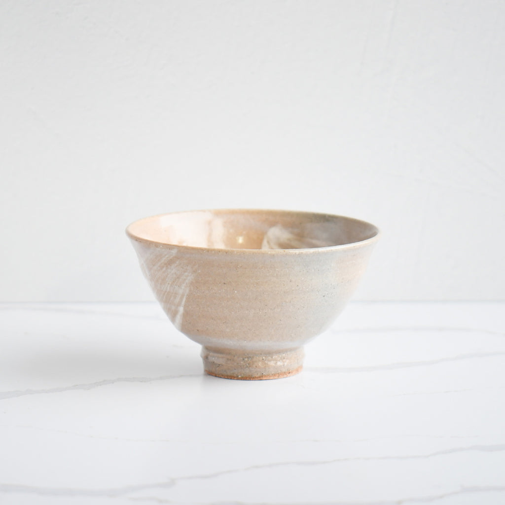 Other side of the bowl that are light grey and hint of light orange. Meticulously crafted by hand.