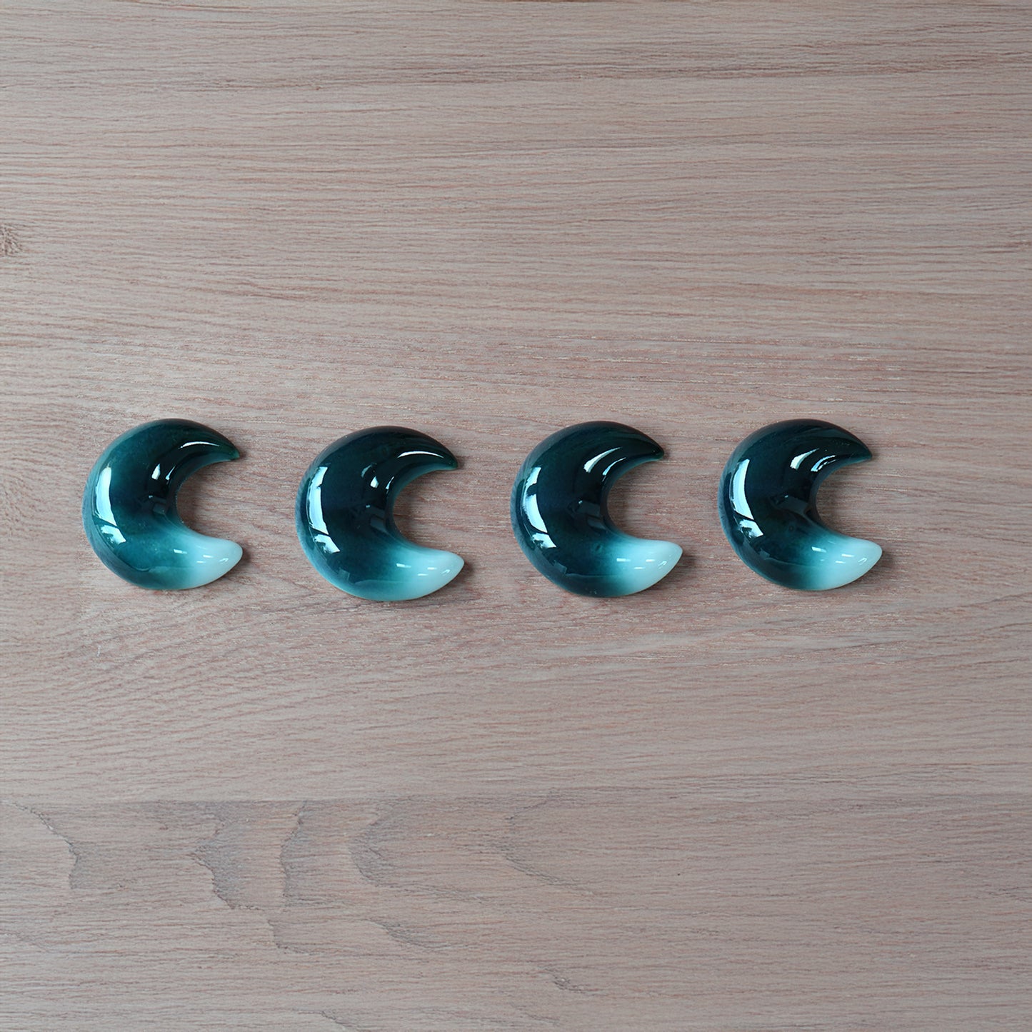 Set of four crescent-moon chopstick rests in a blue-to-white gradient handcrafted by Yoshito Takenishi.