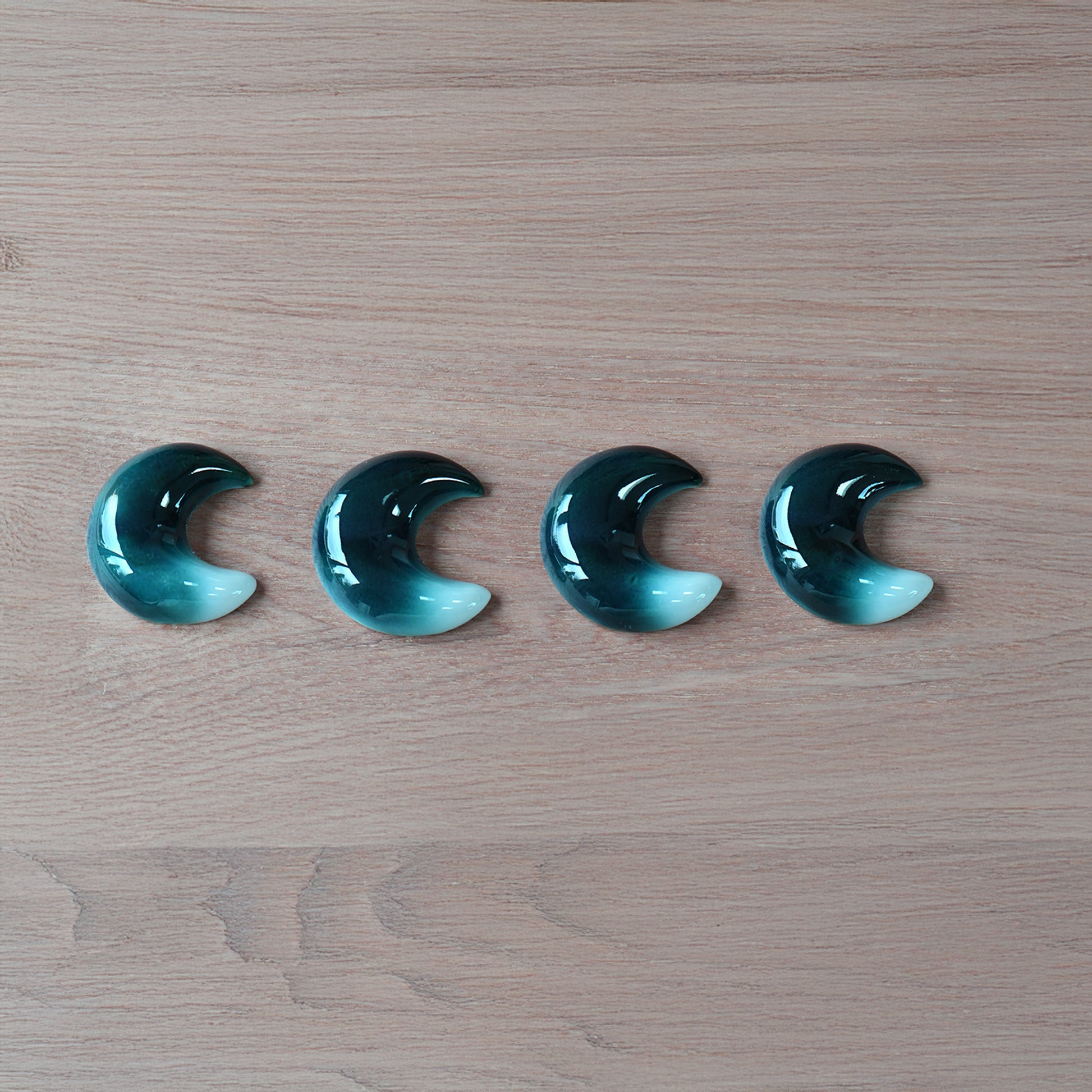 Set of four crescent-moon chopstick rests in a blue-to-white gradient handcrafted by Yoshito Takenishi.