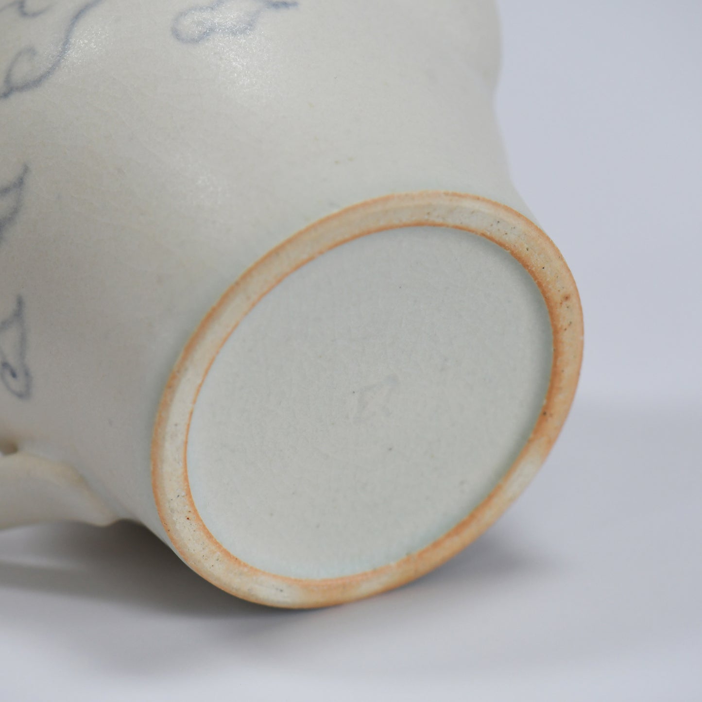 Bottom detail of Fumiyama handmade teapot with natural clay foot