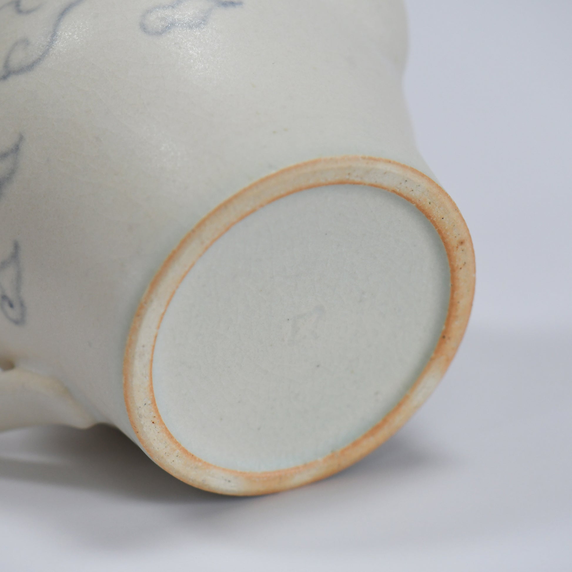 Bottom detail of Fumiyama handmade teapot with natural clay foot