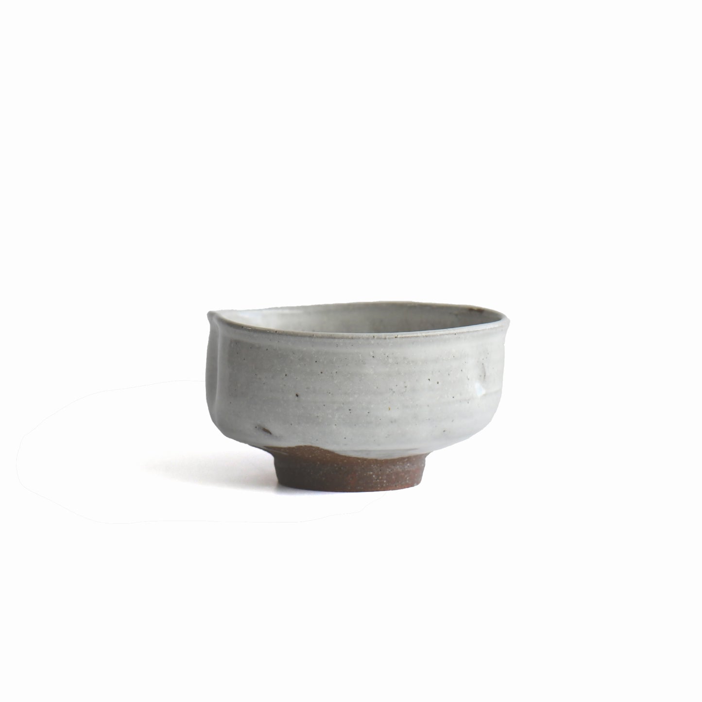 Side view of Hakurei chawan showing subtle twist and natural clay texture.