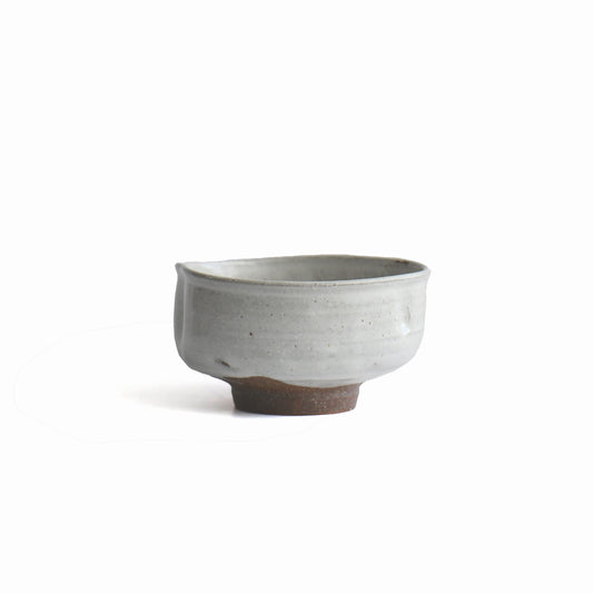 Side view of Hakurei chawan showing subtle twist and natural clay texture.