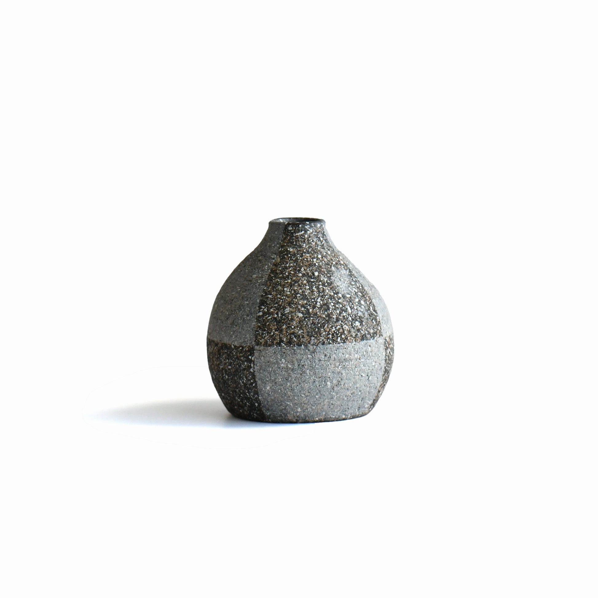 Back view of Gen’en bud vase showing subtle surface planes and speckled stoneware texture