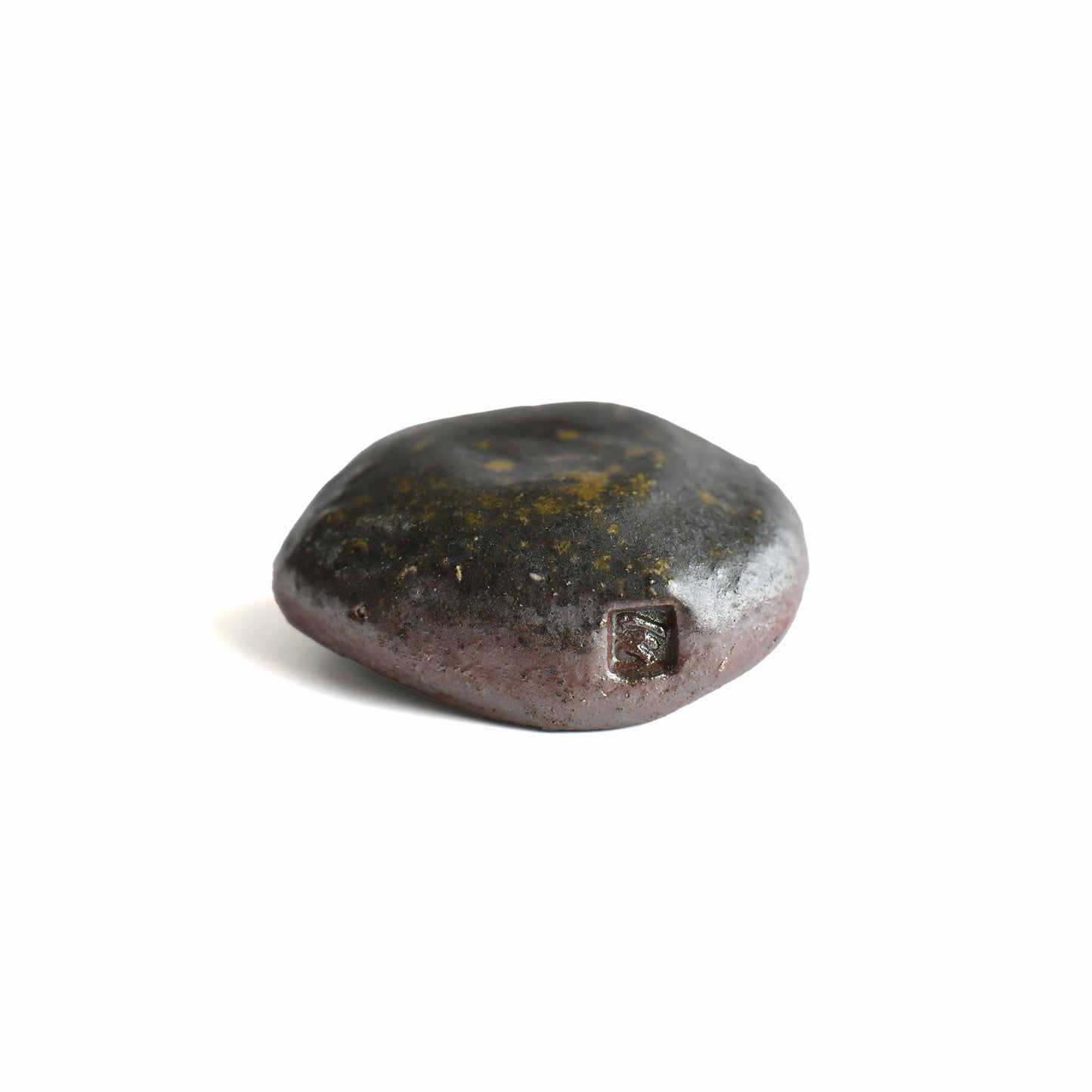 Close-up of the maker's mark on the handmade Bizen shiitake chopstick rest