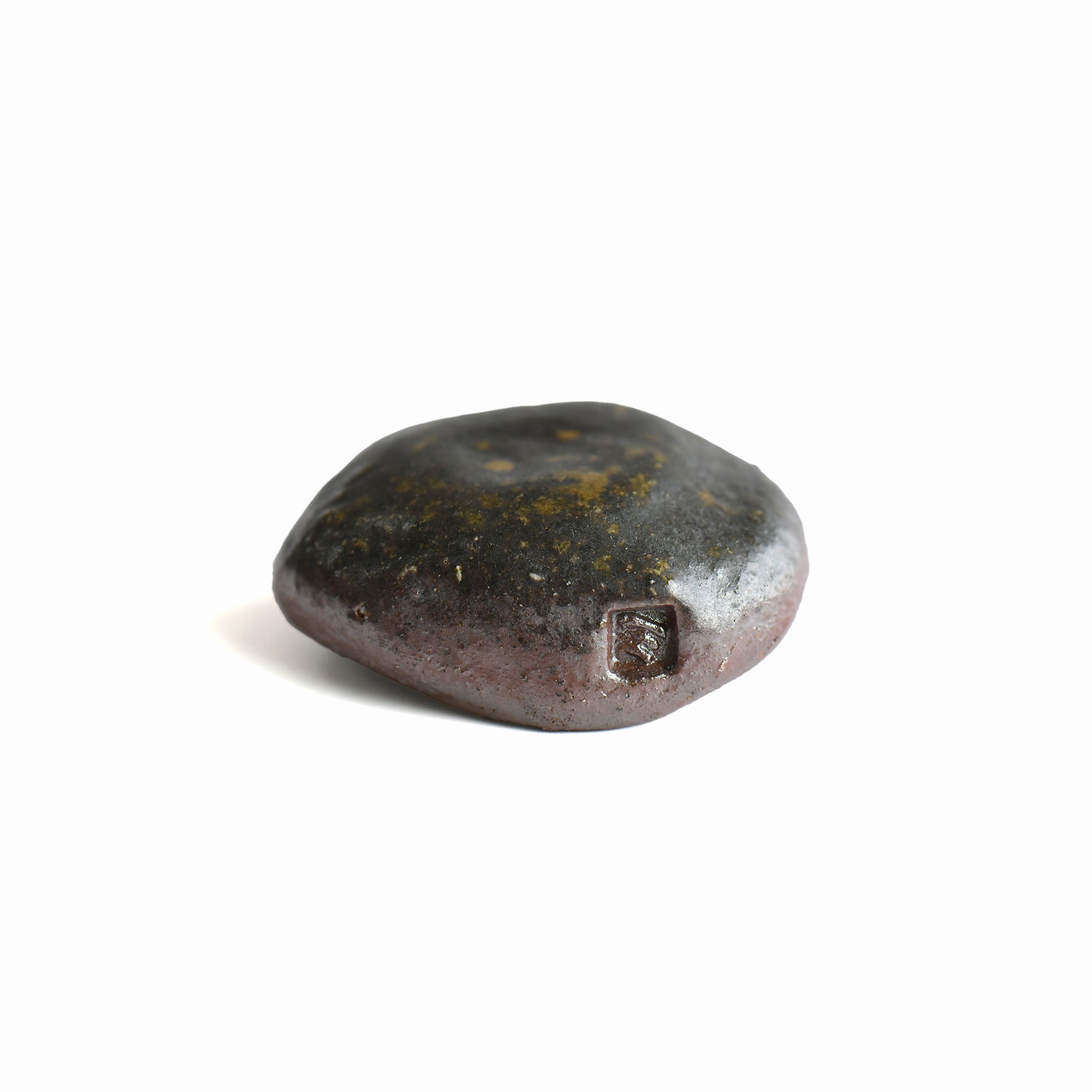 Close-up of the maker's mark on the handmade Bizen shiitake chopstick rest