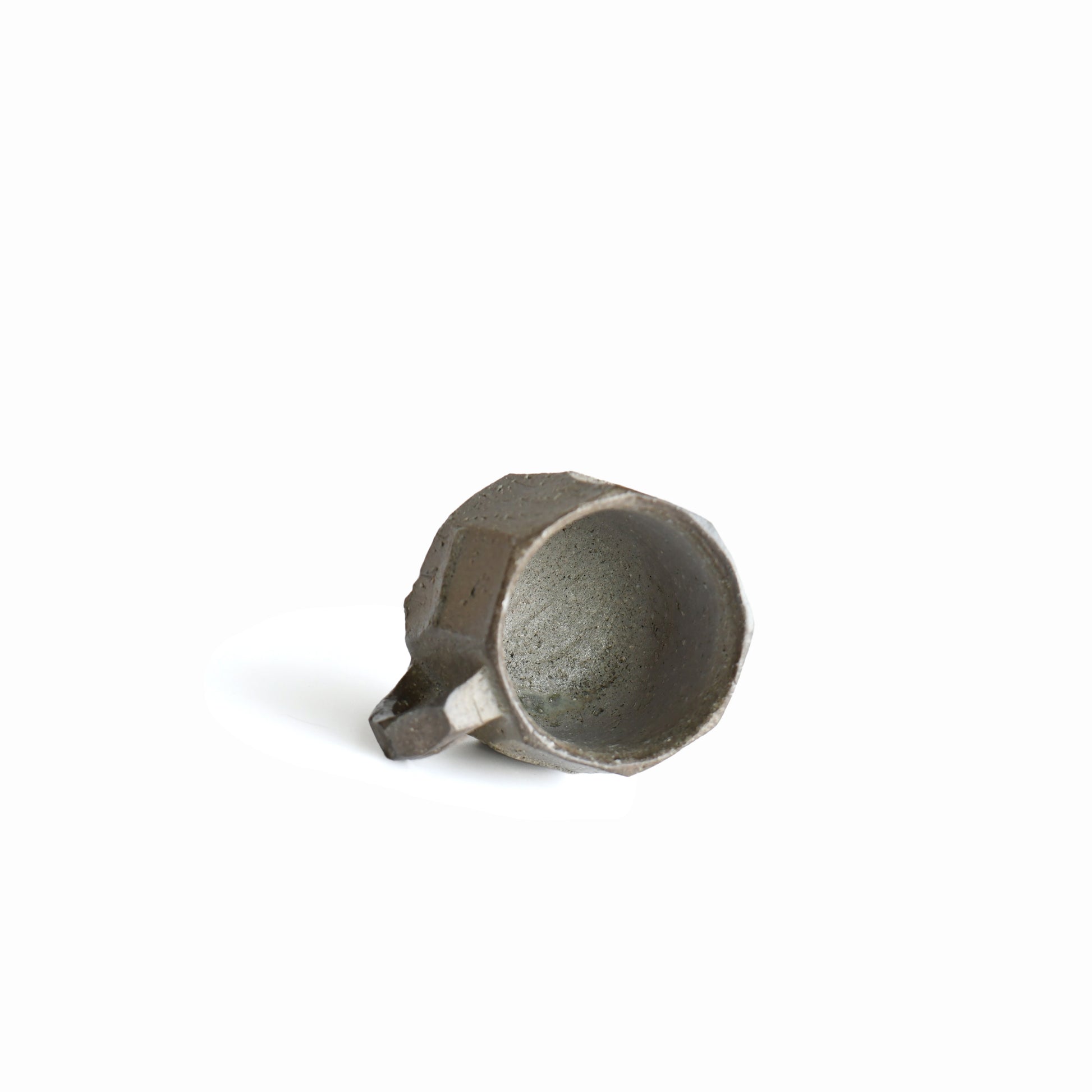 Interior of Seihitsu Sueki Mug Small #1 displaying natural stoneware finish and subtle tonal variation inside the cup.