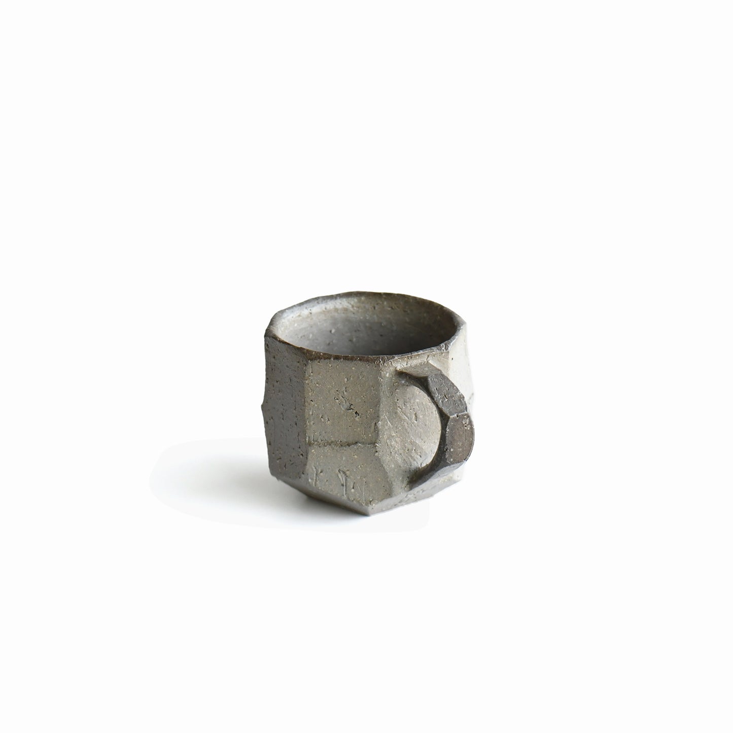 Close-up of angular handle and carved matte surface on Seihitsu Sueki Mug Small #1, highlighting intimate scale and handmade edges.