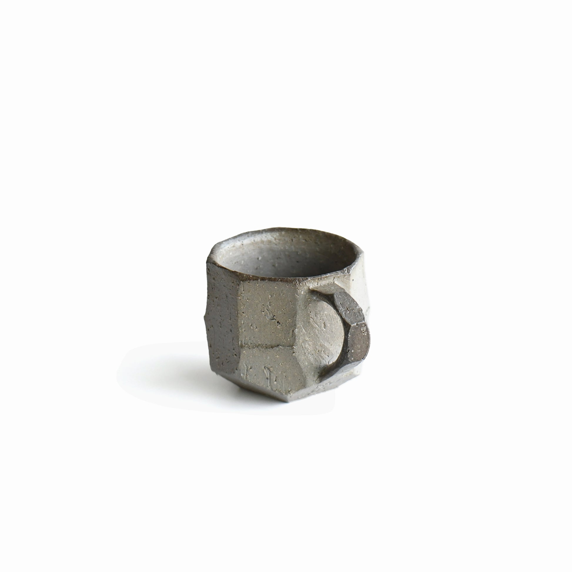 Close-up of angular handle and carved matte surface on Seihitsu Sueki Mug Small #1, highlighting intimate scale and handmade edges.