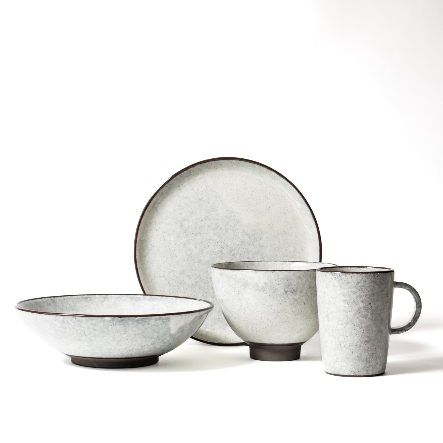 Ivory and charchol edge 4 pieces dinnerware set. Salad plate, pasta bowl, bowl, and mug.