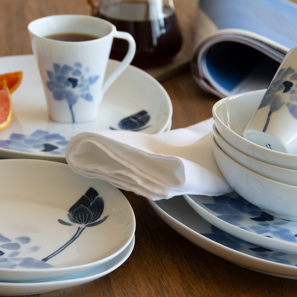 Blue and white Hasu Japanese tableware with morning coffee and newspaper