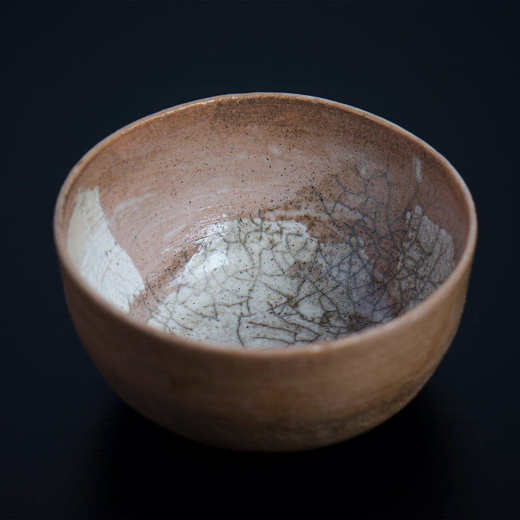 The inside of the bowl has a delicate, off-white crackle glaze. The bowl is a blend of modern and traditional Japanese aesthetics.