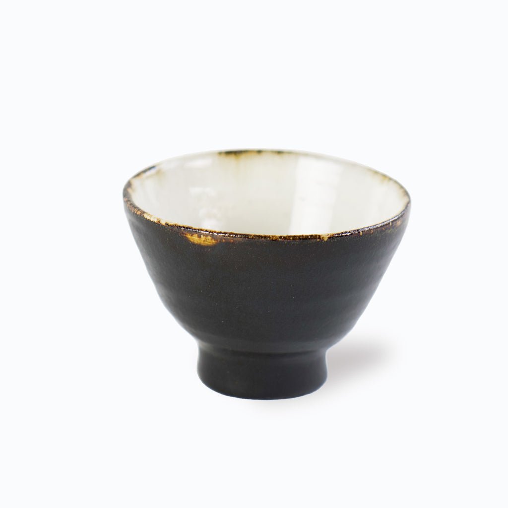Kondo's sake cup. White inside and black outside. Gold like color is shown on the edge that makes this cup very special.