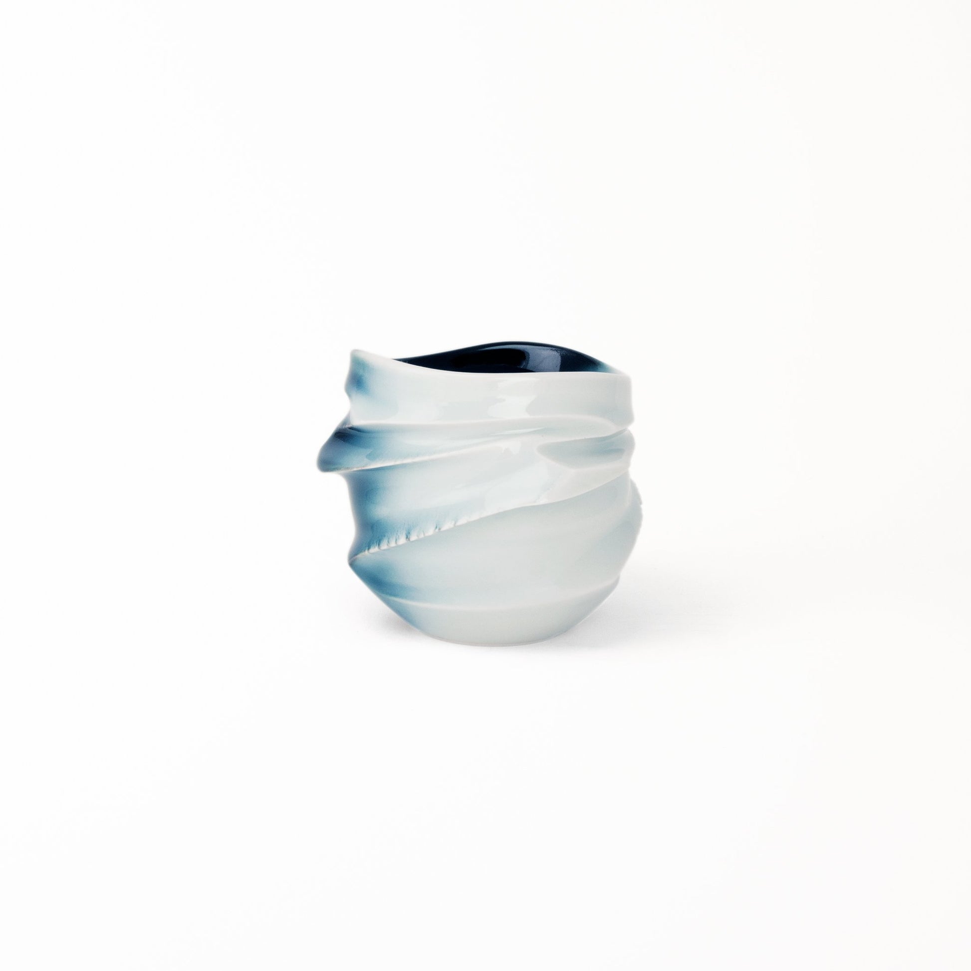 Sake tea cup Suiroku Takenishi’s white glaze diffusing to deep midnight blue merging with Ikeda’s organic swirl design