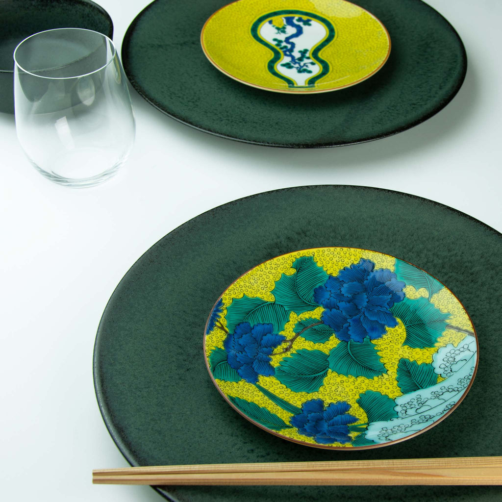 Yellow patterned dish with pine showing through green bordered gourd shape paired with dark Koku plate